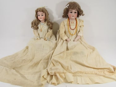 (2) ANTIQUE A.M. BISQUE HEAD DOLLS: