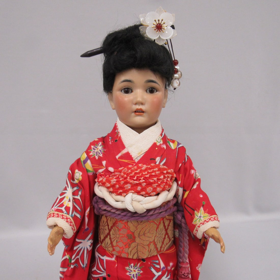 16 IN. BEAUTIFUL ASIAN GIRL:: MARKED 1329 GERMANY, HALBIG. BISQUE SOCKET HEAD, SLEEP EYES, OPEN MOUTH WITH TEETH, FINE OILY BISQUE, JOINTED COMPO BODY, ORIGINAL WIG, WAS NOT TOTALLY UNDRESSED BECAUSE OF INTRICATE OLD JAPANESE OUTF