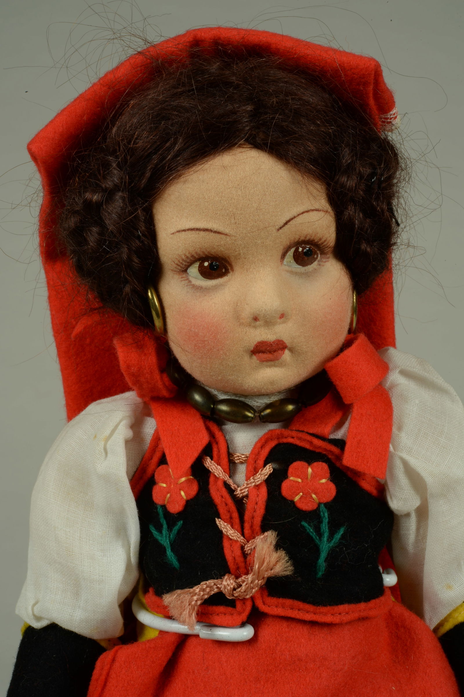 14 IN. ALL ORIGINAL LENCI DOLL TAGGED "SORA":: LENCI, ITALY, CIRCA 1935, MOLDED & PAINTED FELT HEAD WITH PAINTED FEATURES INCLUDING SIDE GLANCING BROWN EYES, BLUSHED CHEEKS, CLOSED POUTY MOUTH, BROWN MOHAIR WIG WITH COILED BRAIDS, GOLD HOOP