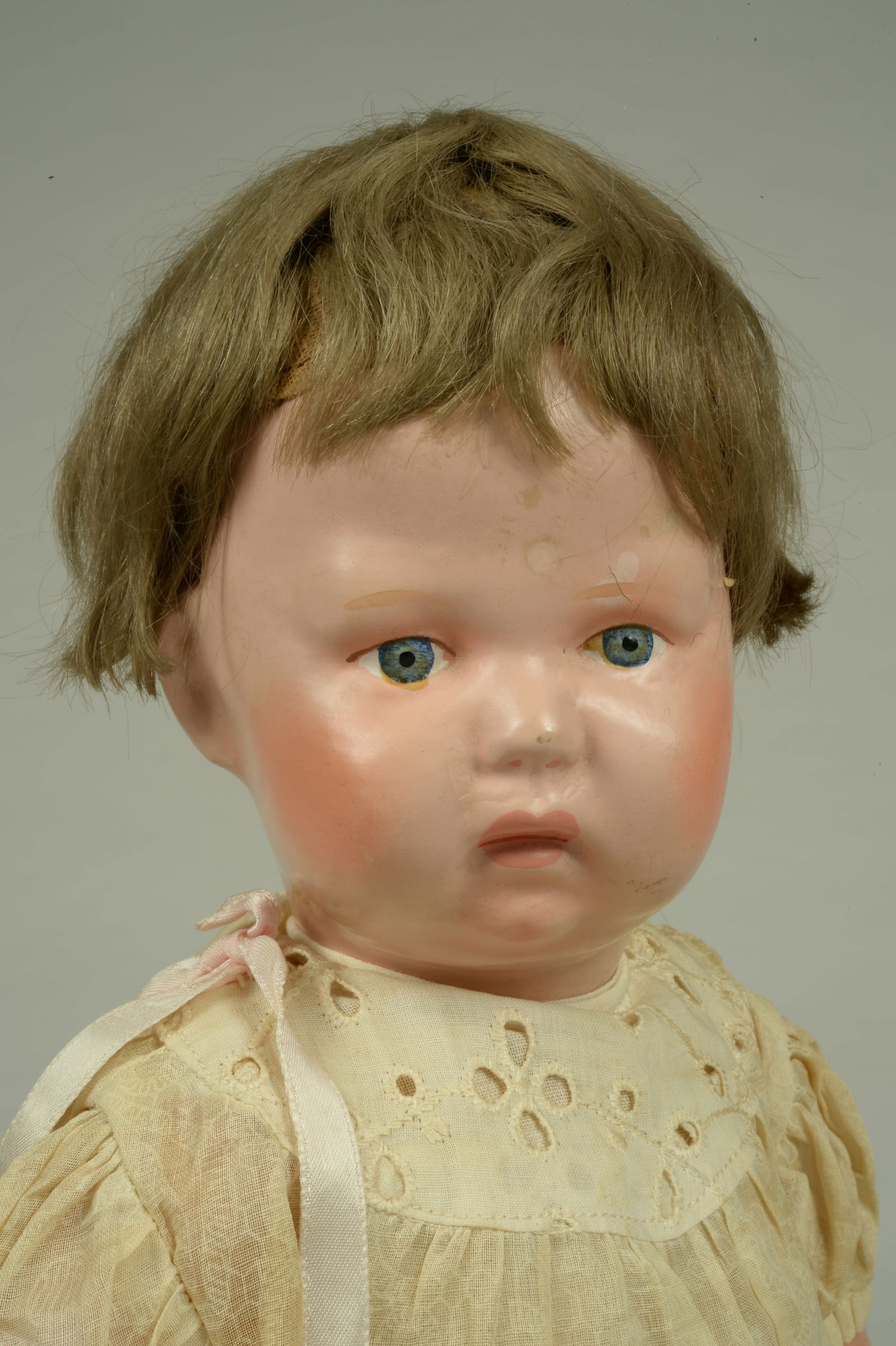 ADORABLE 15 IN. SCHOENHUT "NATURE BABY":: SCHOENHUT, AMERICA, CIRCA 1920, ALL WOOD CHARACTER BABY, MOLDED & PAINTED SOCKET HEAD WITH ORIGINAL BROWN MOHAIR WIG, BLUE/GRAY PAINTED EYES, FULL BLUSHED CHEEKS, CLOSED MOUTH, ON FIVE PIECE