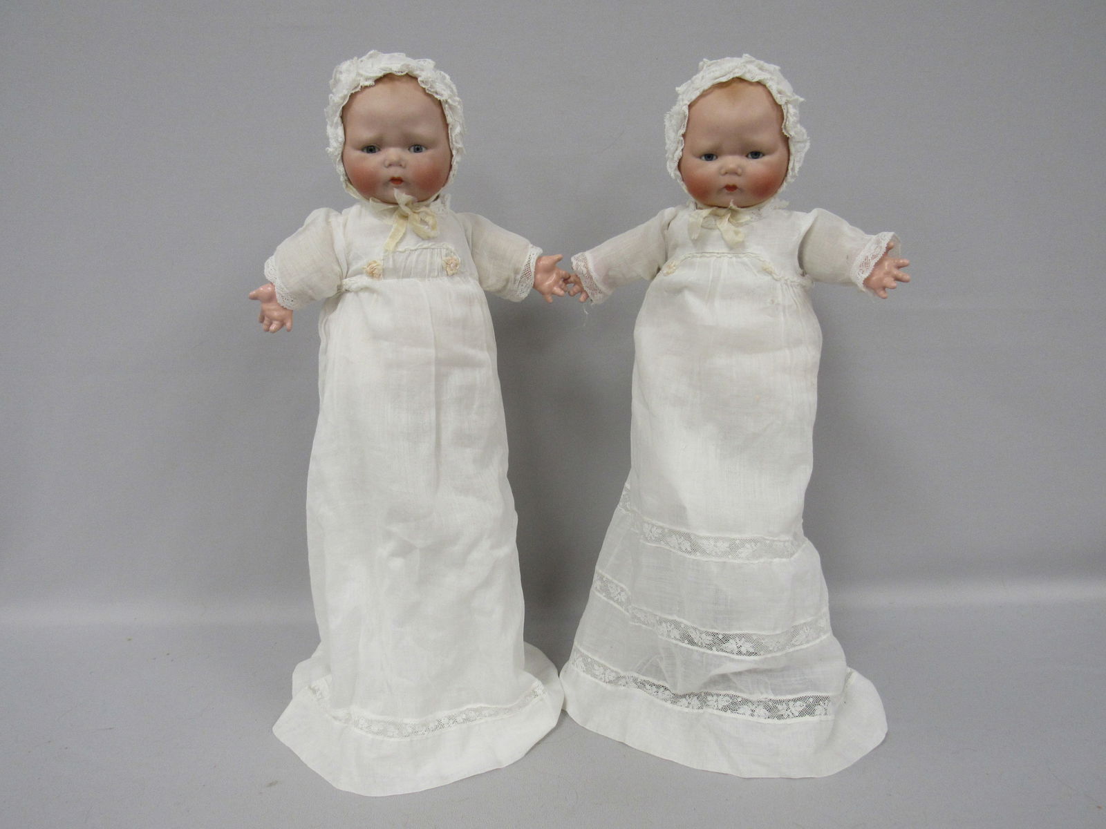 PAIR OF TYNIE BABIES BY HORSMAN:: MARKED 1924 BY H HORSMAN INC. TWINS WITH BISQUE DOME HEADS, SLEEP EYES, CELLULOID BODIES, ORIGINAL OUTFITS, ONE IS TAGGED - G