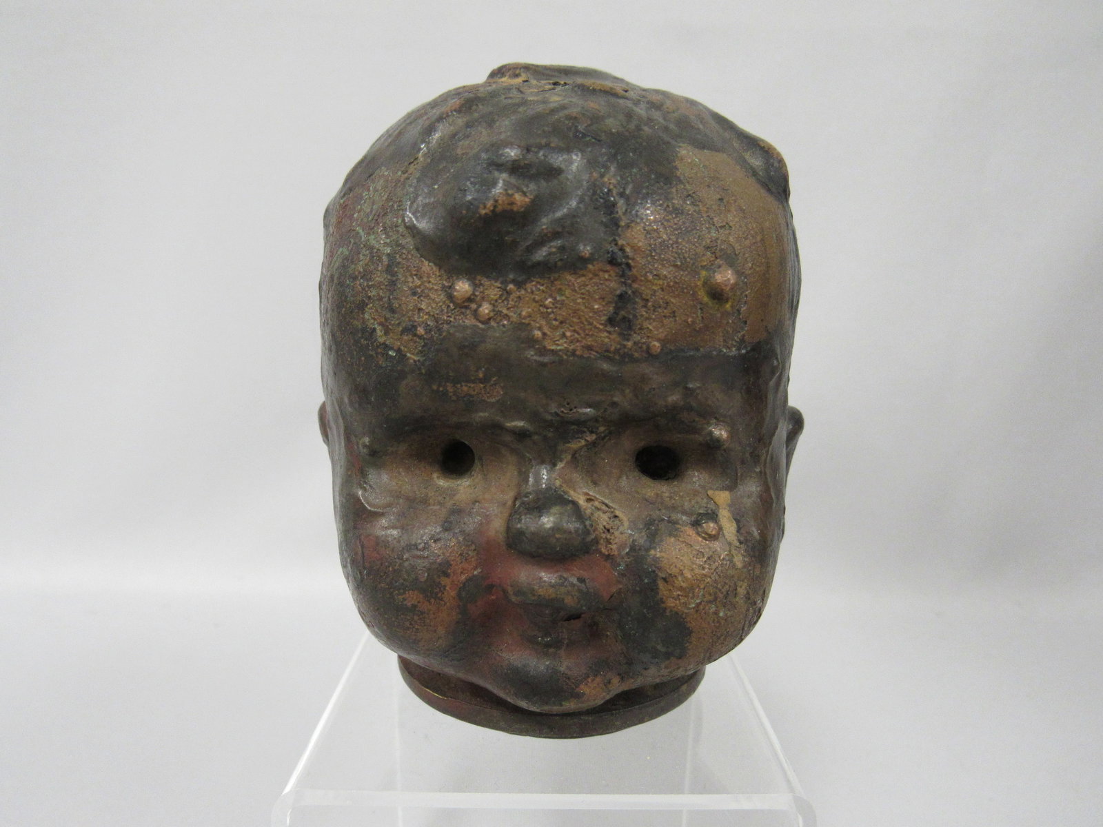BRONZE DOLL HEAD MOLD WITH FLANGE NECK:: 4 1/4 IN. H, 3 1/4 IN. W, 3 3/4 IN. D. THESE EARLY & HEAVY MOLDS WERE USED FROM APPROX. 1940'S TO LATE 1960'S FOR THE PRODUCTION OF RUBBER, VINYL OR COMPOSITION HEADS IN EUROPE & THE U.S. THEY WERE SU