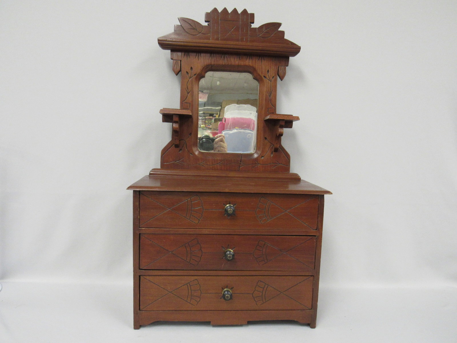 LATE VICTORIAN ERA DOLL'S DRESSER:: WITH MIRROR & CANDLE STANDS. BASE HAS 3 DRAWERS WITH ORIGINAL PULLS & CARVED DECOR & SPOON CARVINGS ON MIRROR HARP & CROWN. EACH DRAWER HAS CARVINGS ON DRAWER FRONTS. THE MIRROR IS ANTIQUE & ORIGINAL,