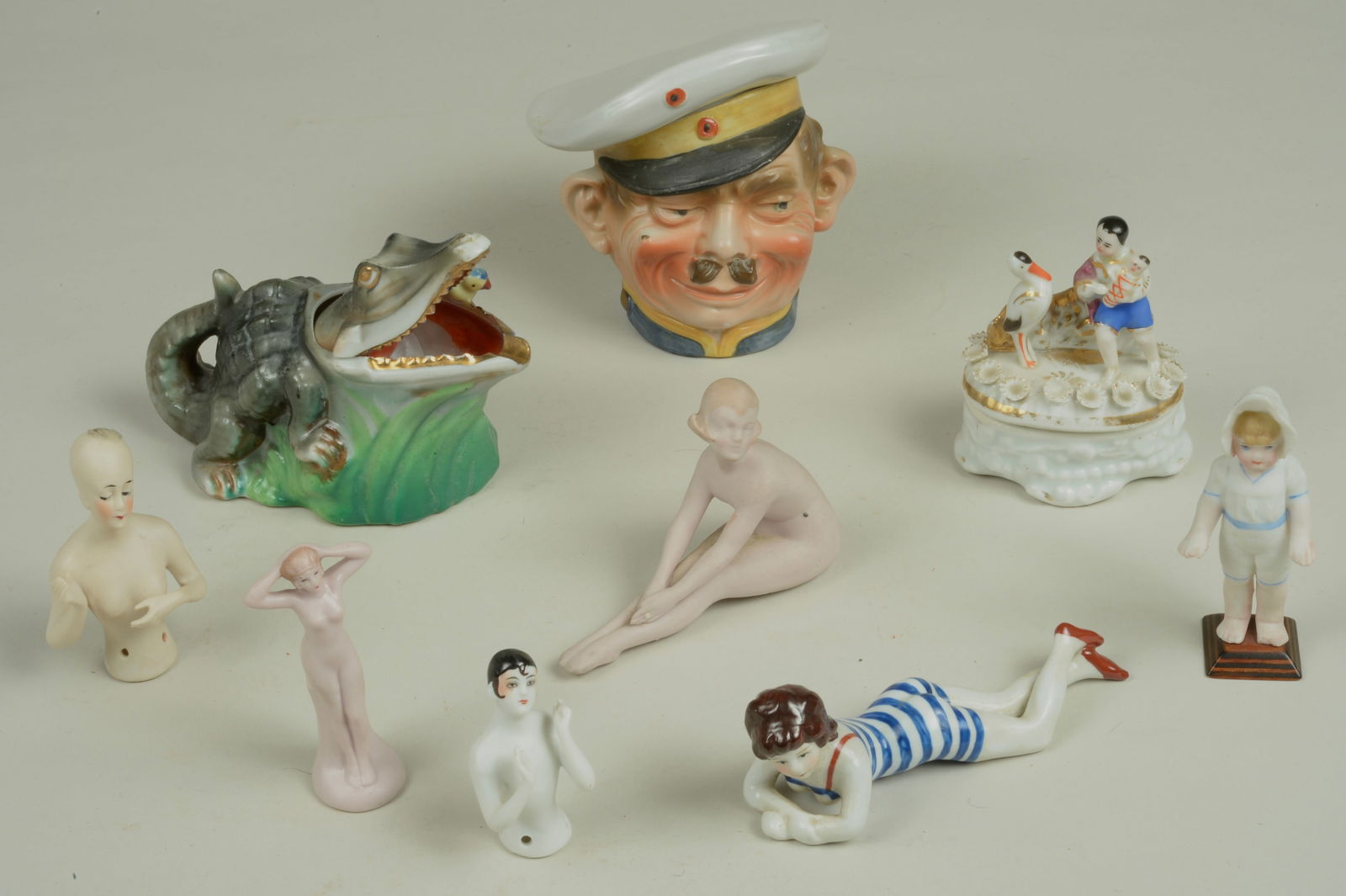 BATHING BEAUTIES & HALF DOLLS:: A LOVELY GROUP OF EARLY 20TH CENTURY GERMAN PORCELAIN FIGURINES OF ROYALTY INCLUDING QUEEN ELIZABETH & DIANE DE POITIERS, ALL 8 INCHES TALL - EXCELLENT