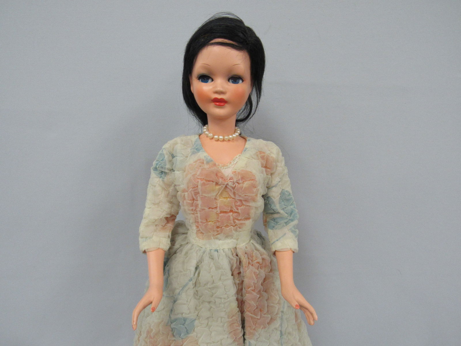 25 IN. ITALIAN SHOLINI "SONIA" MARKED OTTOLINI:: ORIGINAL DRESS, PEARLS, PAINTED SHOES, ITALIAN HARD PLASTIC, FLIRTING EYES, HOMEMADE STAND FOR HOLES IN FEET - G