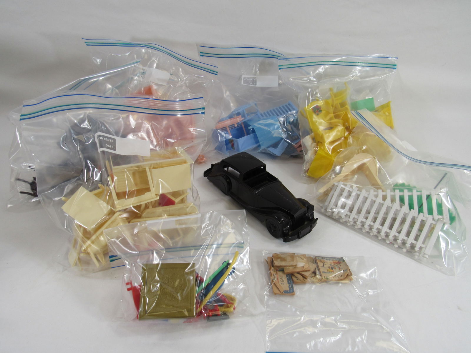 6 BAGS '50'S PLASTIC DOLLHOUSE FURNITURE:: MOST MARKED BEST OR MARX. ALSO INCLUDES A 9 IN. CAR & 1950'S COLANDERS. CLEAN PLAYED WITH CONDITION - G