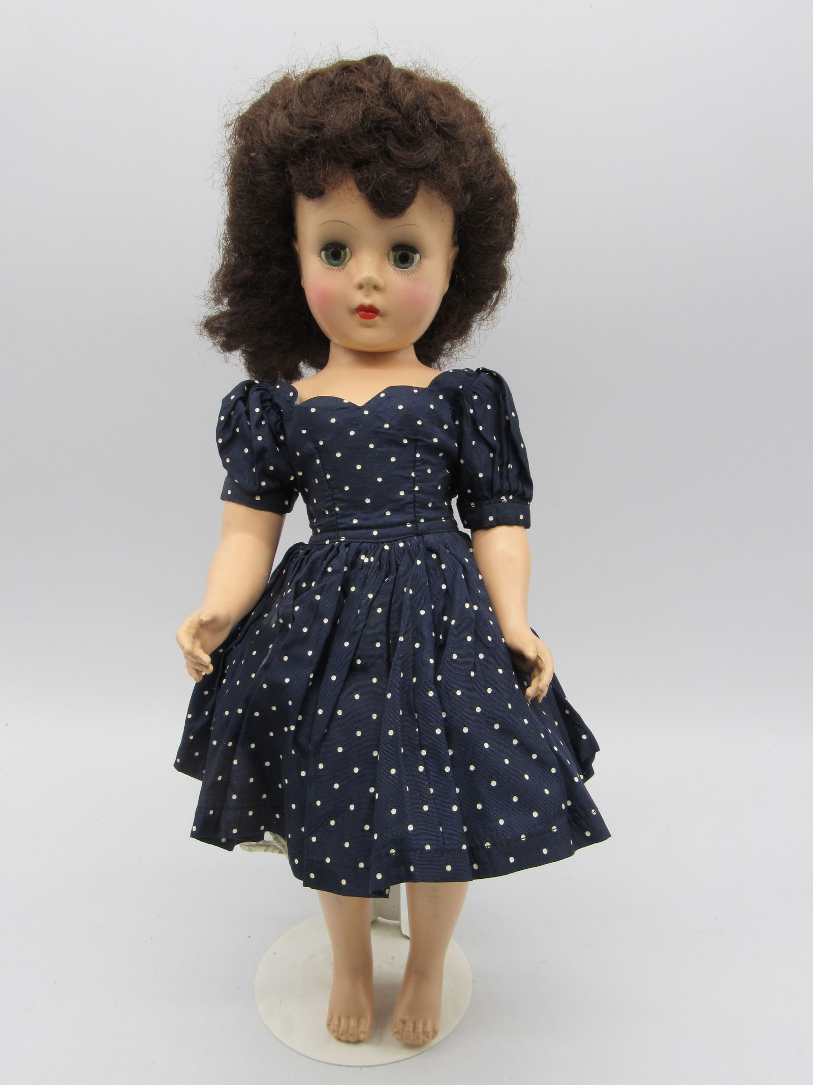 18 IN. MARY HOYER "GIGI":: BRUNETTE HARD PLASTIC WITH TAGGED HOYER DRESS, NO SHOES, GOOD COLOR, WIG IS A LITTLE STIFF - G