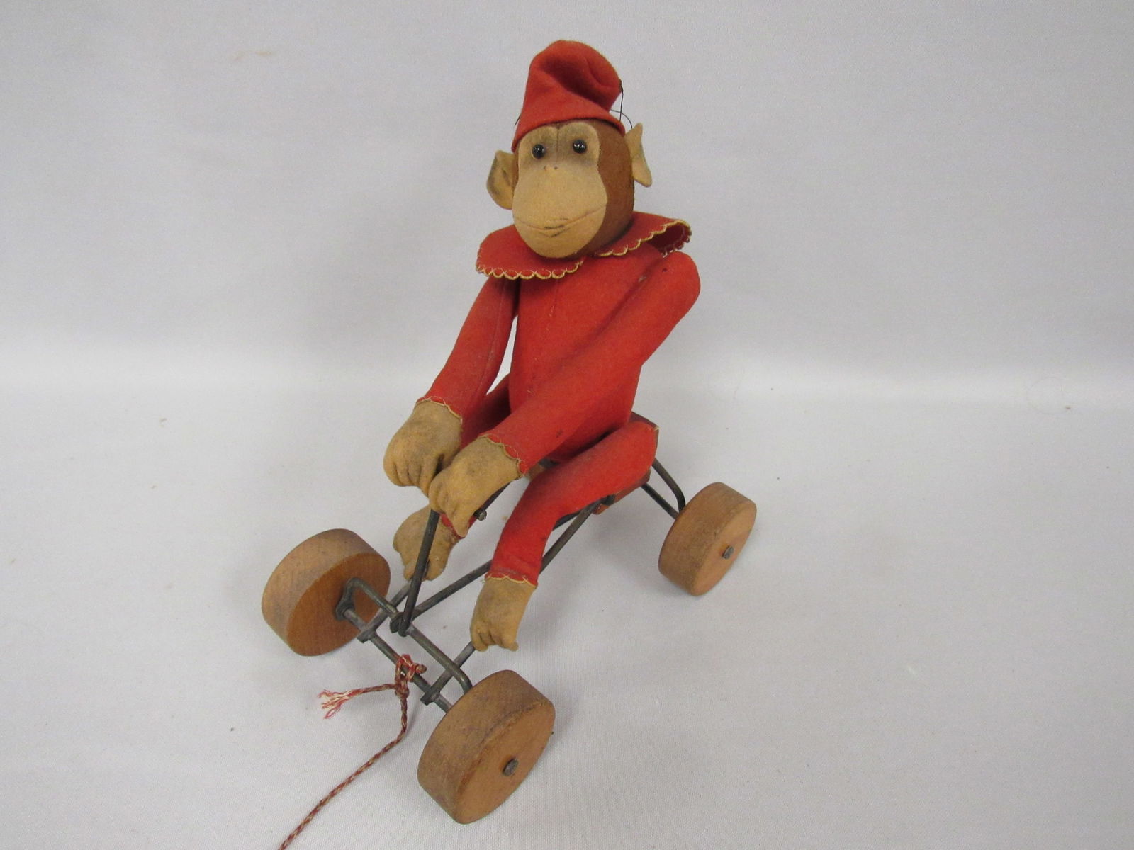 STEIFF ALL FELT "RECORD PETER" MONKEY:: ON ROLLING CART. APPROX. 1913. MOVES AS HE PUMPS THE CART. ORIGINAL - G
