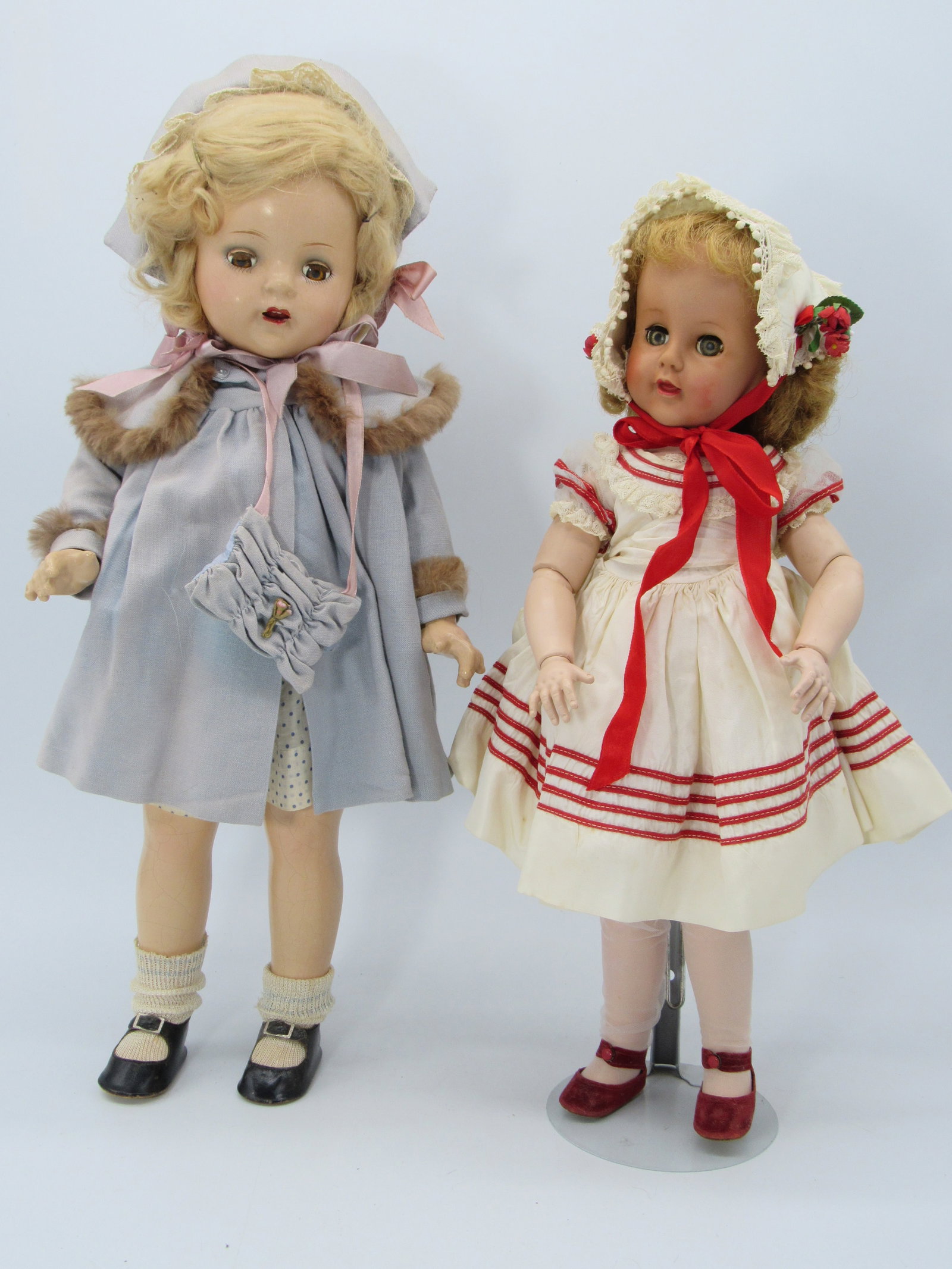 M. ALEXANDER PRINCESS ELIZABETH & MADELAINE:: 19 IN. M. ALEX. COMPO PRINCESS ELIZ. & 18 IN. MADELAINE WITH VINYL FACE & H. PLASTIC BODY. COMPO LEGS ARE WITH SOME CRAZING, HER OUTFIT IS ORIGINAL & WITH TAGGED OUTFIT & IS VERY CLEAN
