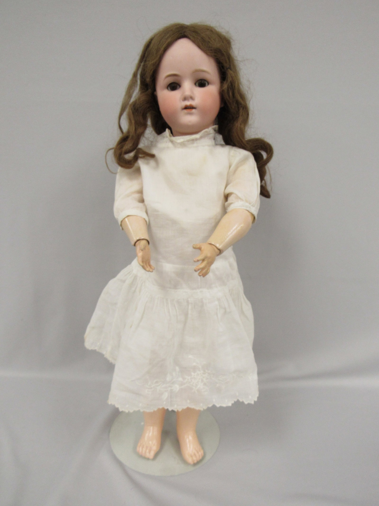 25 IN. BISQUE HEAD GERMAN CHILD:: MARKED GERMANY B-6, SOCKET HEAD ON VERY CLEAN & ORIGINAL BODY, LIMBS & HANDS, NO REPAIRS OR TOUCH-UPS. BISQUE HEAD IS MOLDED & PAINTED BROWS IS ALSO FREE OF ANY DAMAGE OR REPAIRS