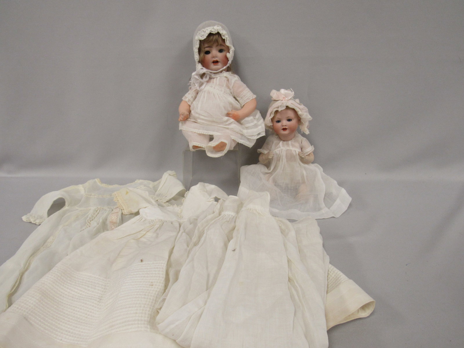 PAIR OF BISQUE HEAD BABIES WITH EXTRA BABY DRESSES (1 of 17)