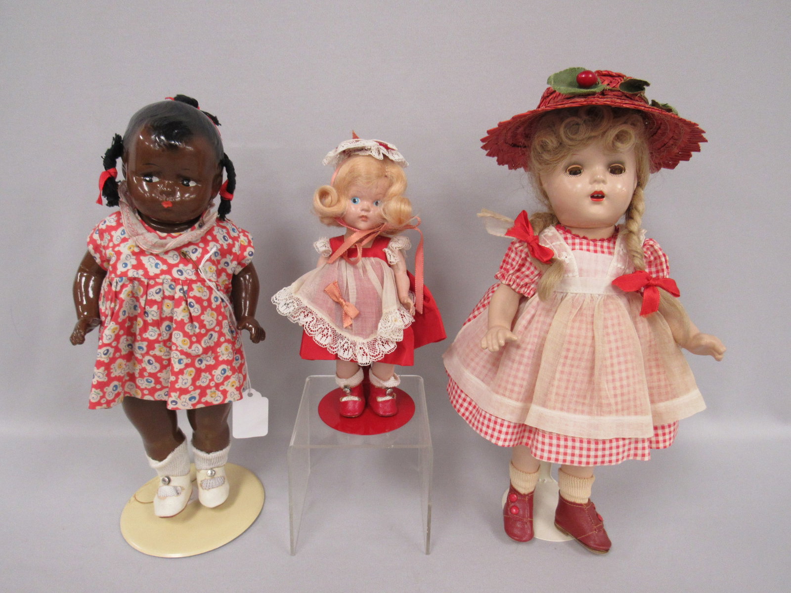 3 DOLL LOT:: 12 IN. BLACK "GRUMPY" VERY LITTLE CRAZING, ALEXANDER "McGUFFY ANN" 13 IN. UNTAGGED, CRACKING & CRAZING ON LIMBS & EYES & VOGUE GINNY TAGGED ORIGINAL OUTFIT, SLIGHT DISCOLORIZATION ON ARM - G