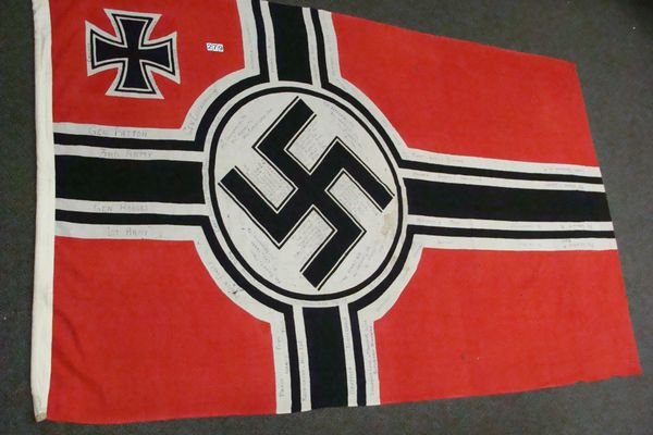 GERMAN W.W. II KREIGSMARINE BATTLE FLAG: (5 FT. W X 8 FT. LONG) PROBABLY FROM LARGE CRUISE OR BATTLESHIP, NICELY MARKED & PROOFED, HAS SINGLE VETERANS WRITING ON FLAG, FLAG IS INTACT & SHOWS WEAR, SOME HOLES & STAINS. THIS IS A NICE WARTIME 