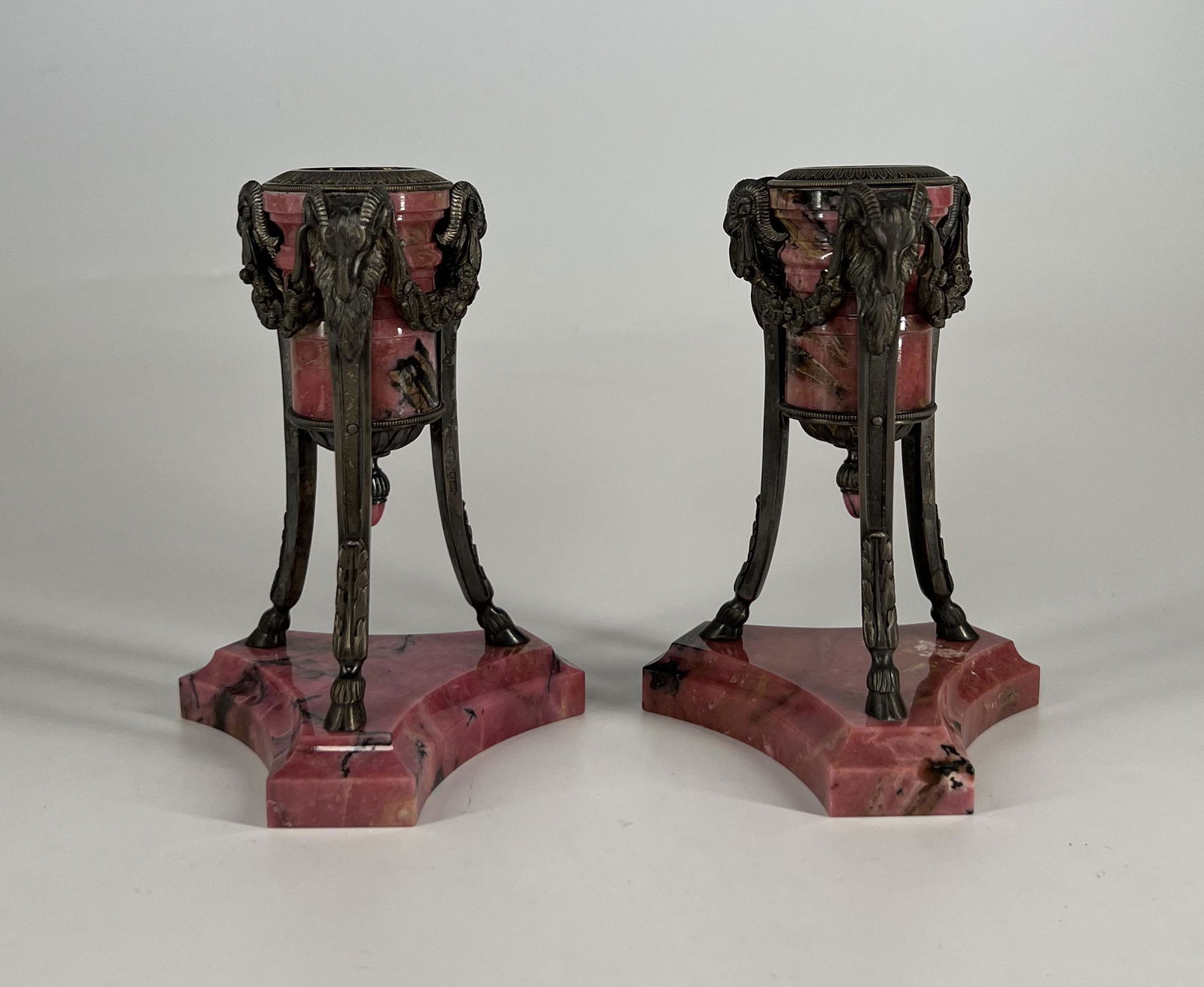 Very fine pair of Russian silver mounted rhodonite candle holders with ram head motifs: Marked: "B.R. G.R." (Brothers Grachev) on the inside of the capitol and on one of the legs on each candle holder. Russian Empire, late 19th century/early 20th century. on three legs with goat feet and