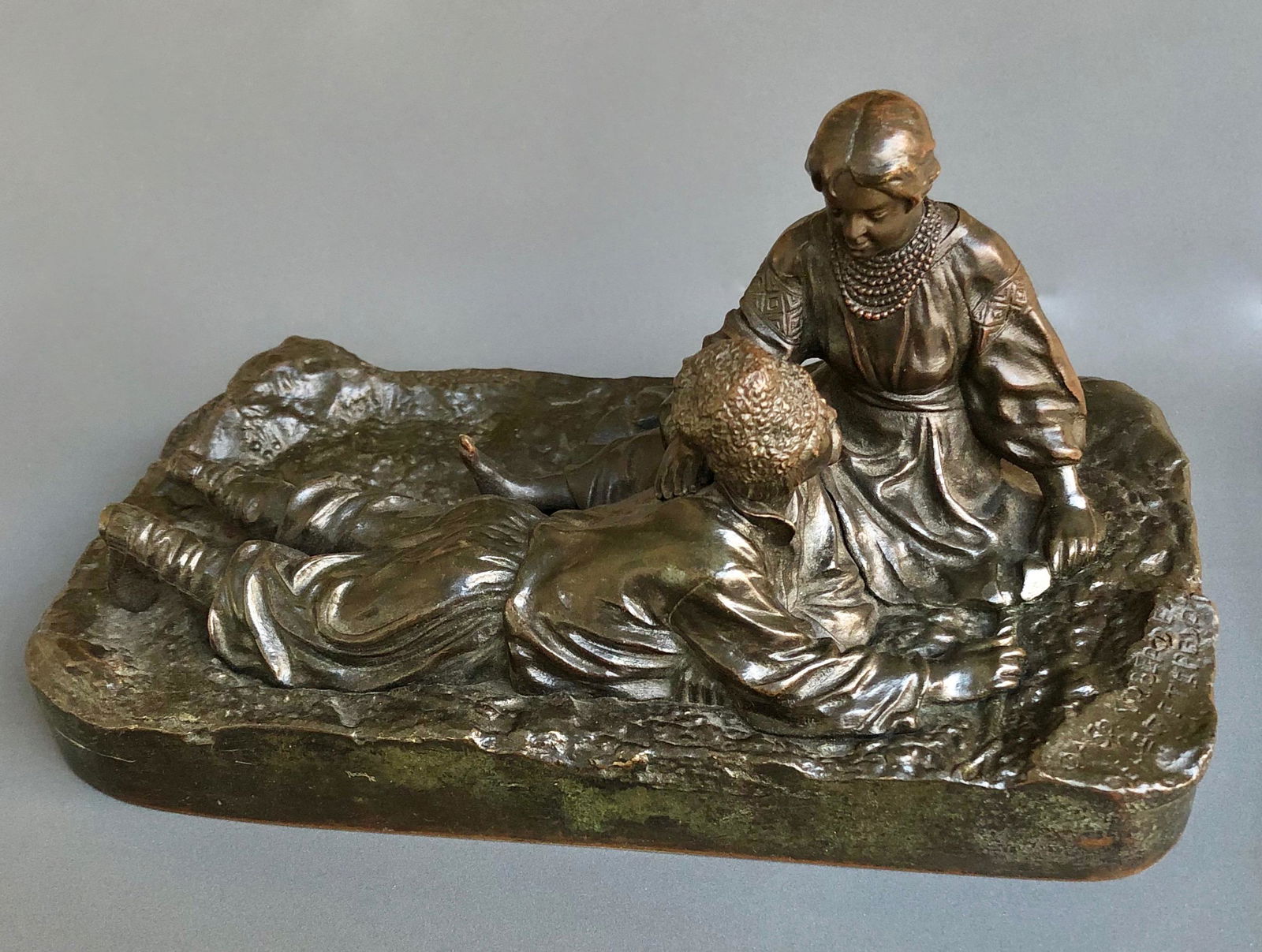 A Russian Bronze group of a Courting Ukraniane Couple by Vasilii Grachev (1831-1905): length - 7 5/8 in. (19.5 cm), width - 11 cm height - 10 cm. The sculpture is signed and dated. inscribed with signature, Ministry of Finance stamp, and with Woerffel foundry mark Bronze. Depicting a c