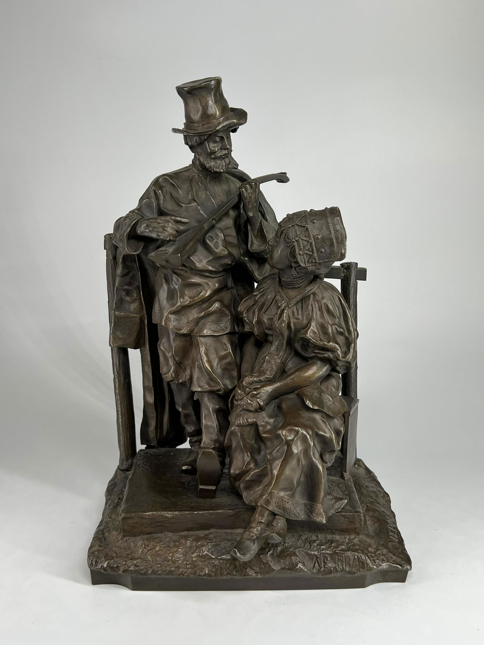 A fine quality Russian bronze group of a balalaika player courting a woman: 12½ in. (32 cm.) high. Marked: Grachev (RUSSIAN 1831-1905), late 19th century. Signed on the base in Cyrillic, with the Woerffel foundry stamp in Cyrillic.