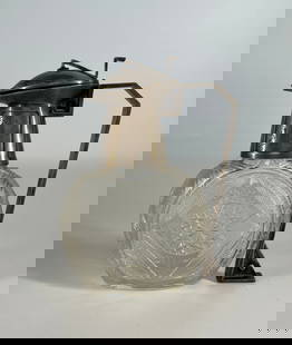 A Very Fine Imperial Russian Silver Mounted Carved Crystal Decanter - Circa 1910: Russian Empire, Moscow 1908-1916. Marked: "Lorie”, Fyodor firm Silver, translucent colorless crystal; faceting, casting, presswork, carving. Marks: "Lorie” alloy number "84”. Colorle