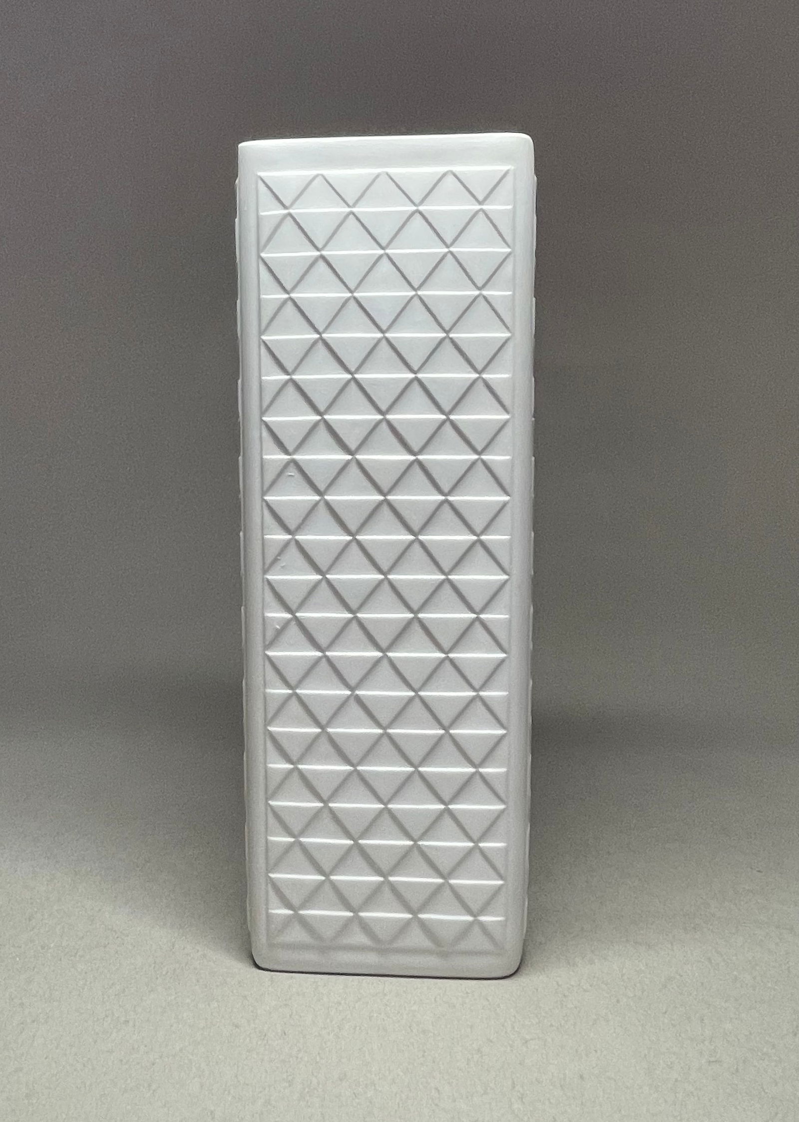 A Vintage bisque tall vase by Hutschenreuther, Mid-Century vase, bisquit white unglazed porcelain.: Exceptionally designed vase made by Hutschenreuther West Germany. Beautiful mid century op art bisquit (white unglazed porcelain) vase. Height: 8 in / 20.5cm
