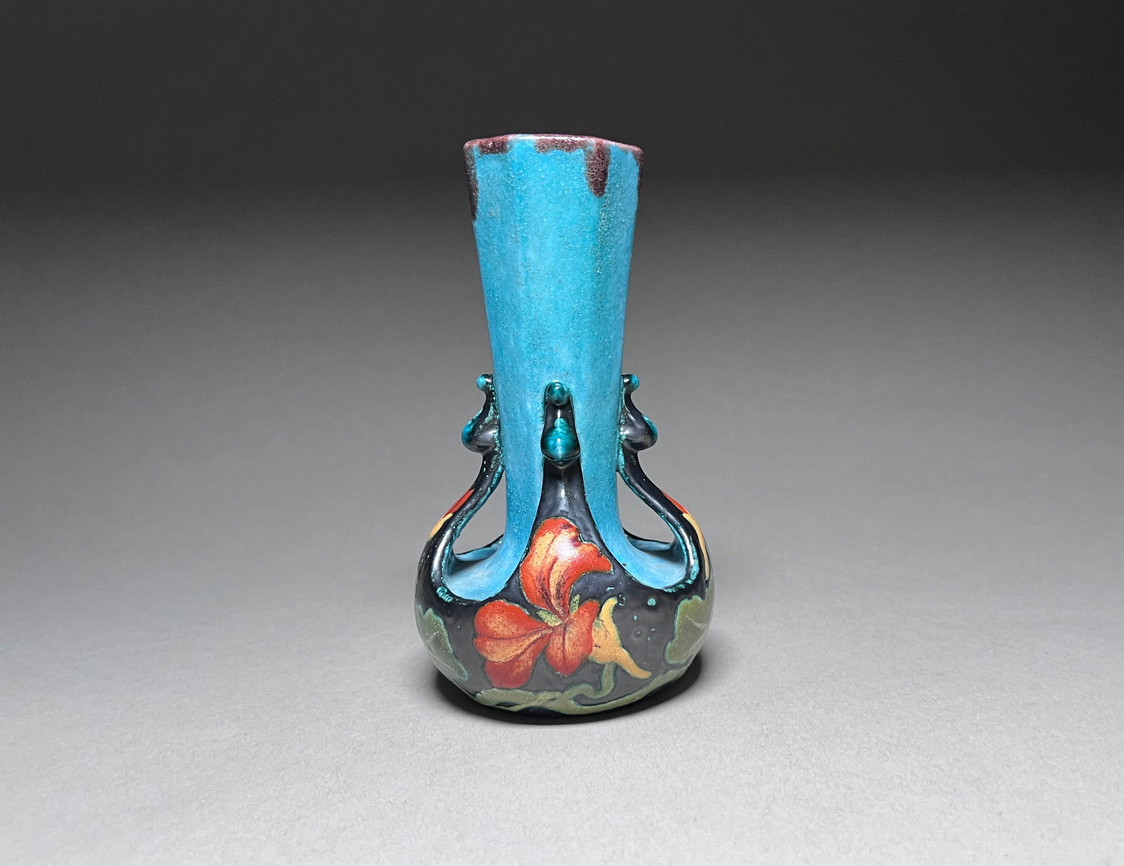 French Stoneware Vase by Alcide Chaumeil (1847-1919) - 19th Century: A whimsical yet boldly designed ceramic vase by Alcide Chaumeil (1847-1919) featuring bright glazes and open work. Brightly glazed, its cerulean blue top juxtaposed by the use of palladium glaze on th