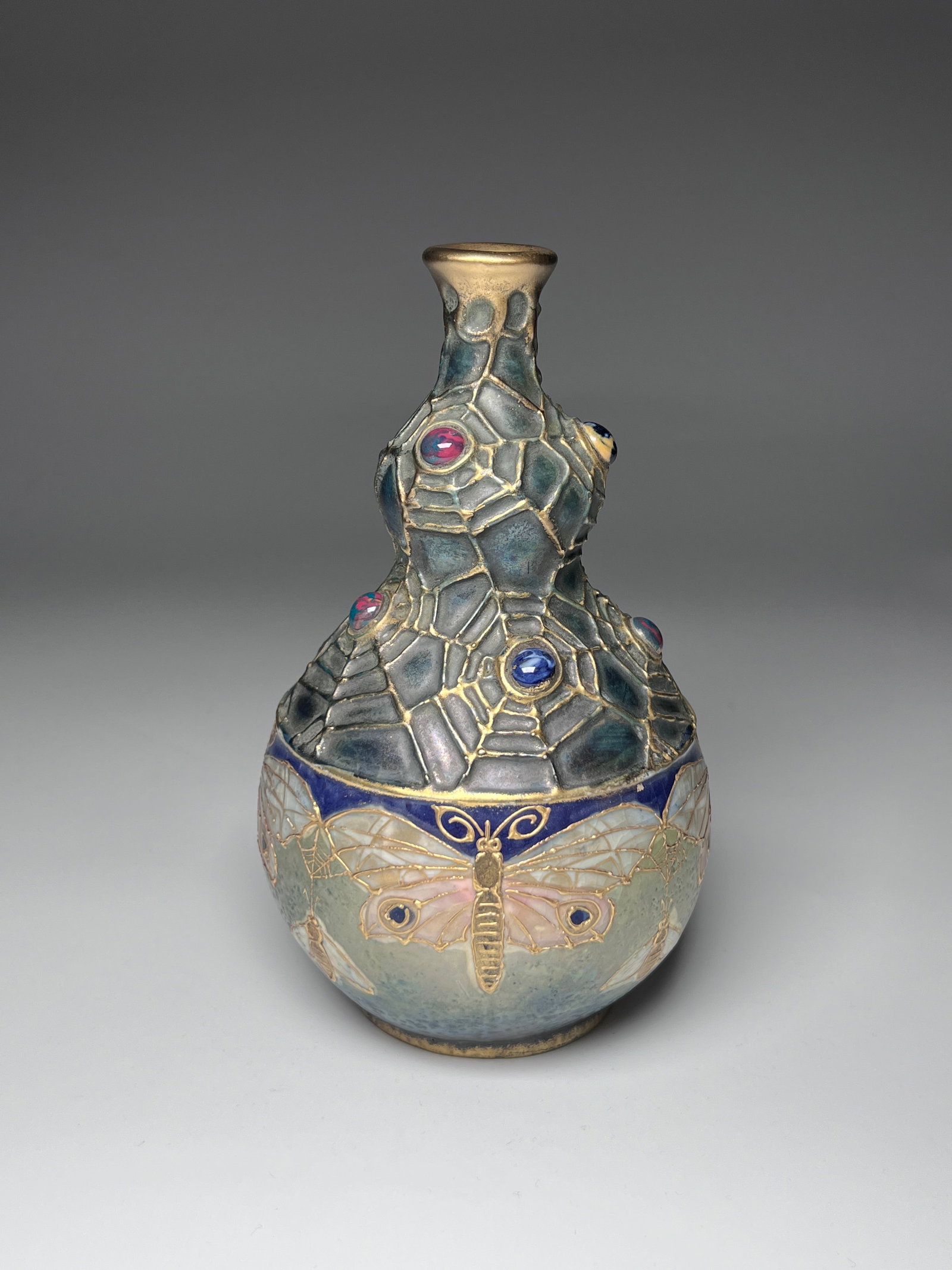 Art Nouveau Gres Bijou gourd shaped vase made by: A Art Nouveau Gres Bijou gourd shaped vase made by Riessner, Stellmacher, and Kessel for Amphora pottery works of Turn-Teplitz in Austria. The vase is made in glazed ceramic, decorated with butterflie