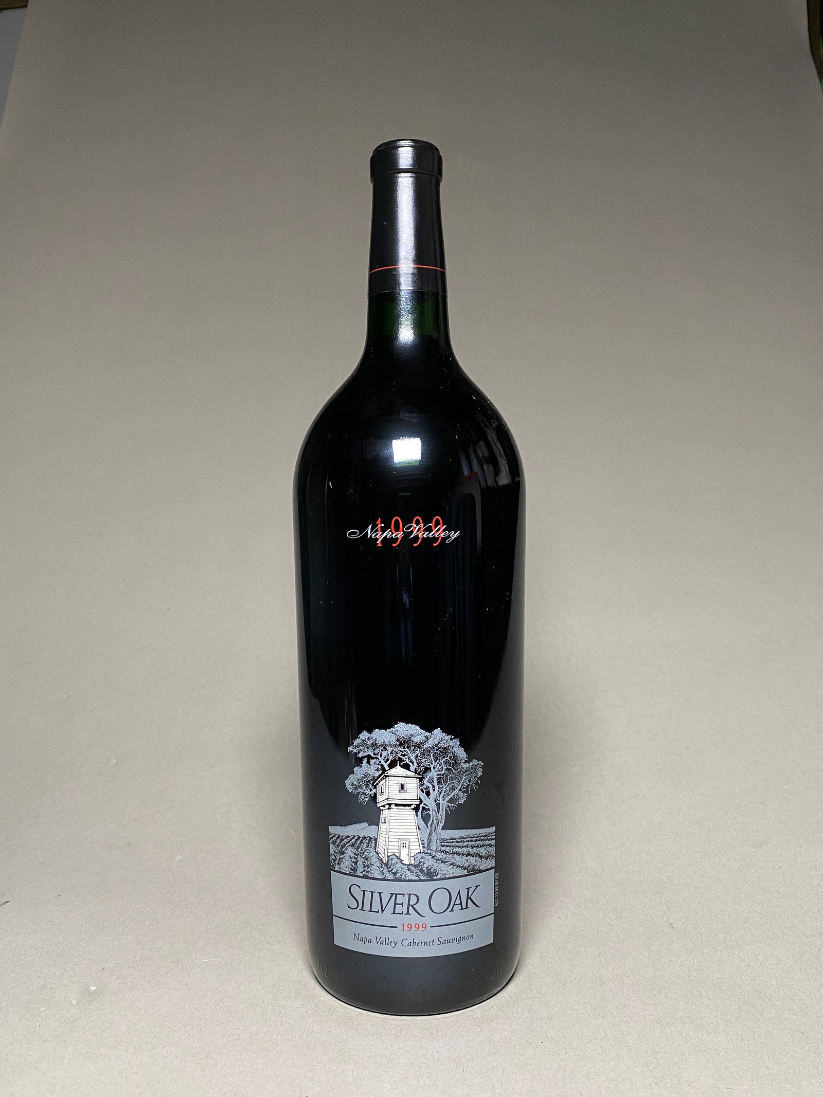 1999 Silver Oak Napa Valley Cabernet Sauvignon Magnum 1.5L: The 1999 Silver Oak Napa Valley Cabernet Sauvignon has a garnet hue with some bricking at the rim. The aromas are reminiscent of a much younger wine in a closed state with dark aromatics of tar and sp