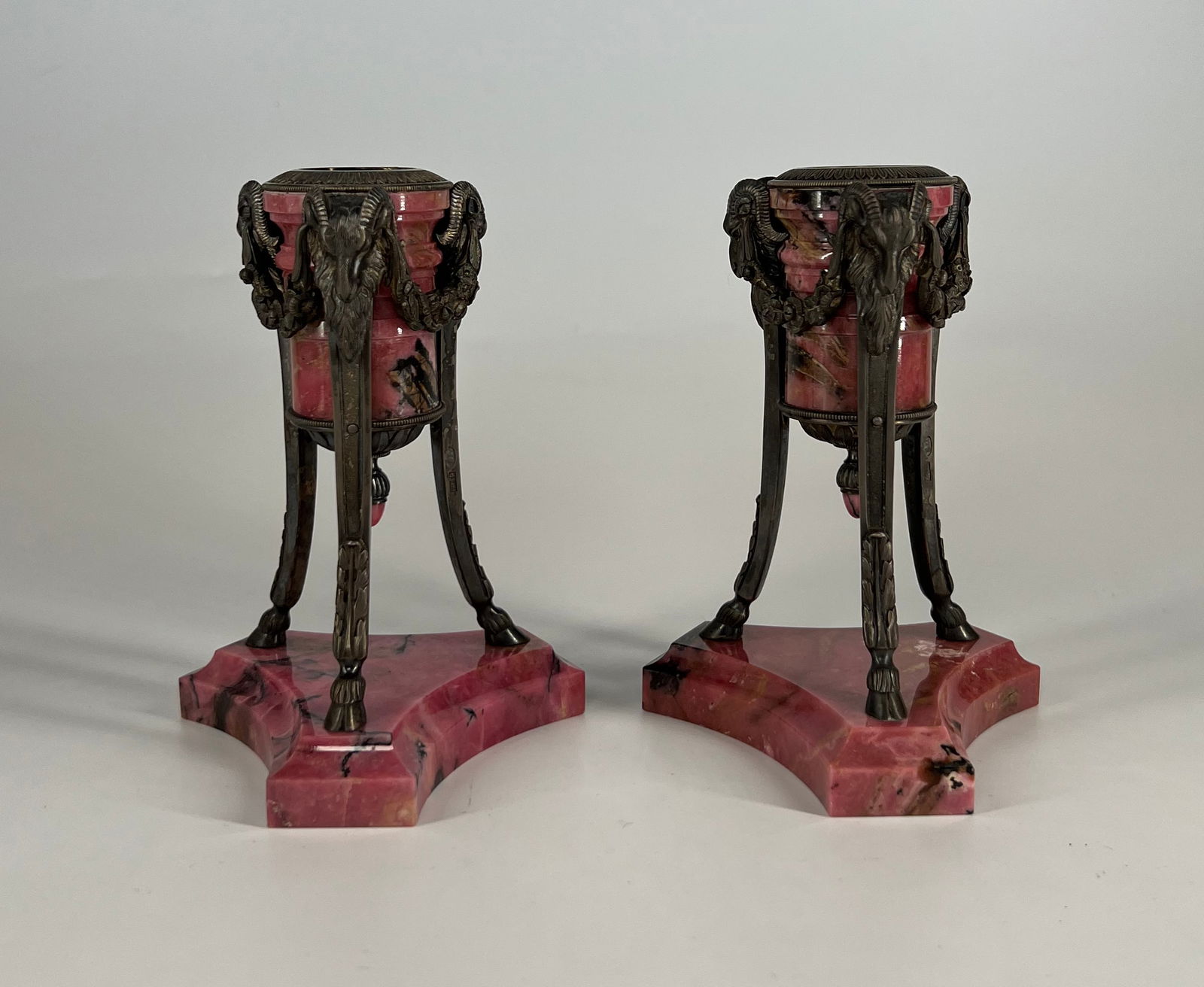 Very Fine Pair of Imperial Russian Silver mounted Rhodonite Candle Holders with Ram Head motifs: Marked in Cyrillic "BR GR" (Brothers Grachev) on the inside of the capitol and on one of the legs on each candle holder. Russian Empire, late 19th century/early 20th century. On three legs with goats