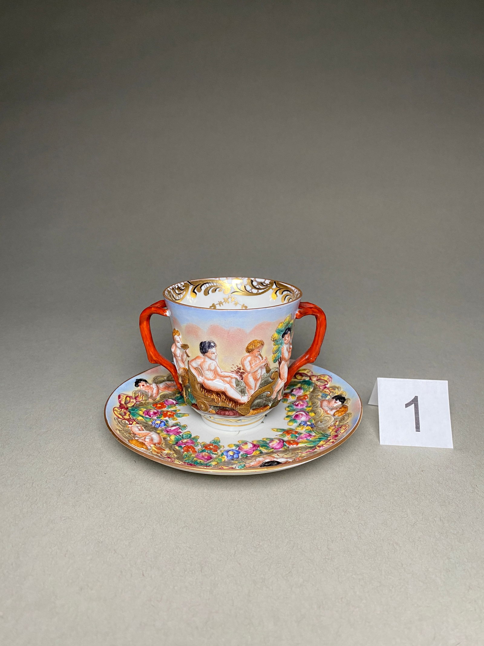 Late 19th Century Capodimonte Porcelain Chocolate Cup, Saucer: Late 19th Century Capodimonte Porcelain Chocolate Cup, Saucer This porcelain chocolate cup, saucer was produced in Italy by Capodimonte in the late 19th century. The cup and saucer are marked with the