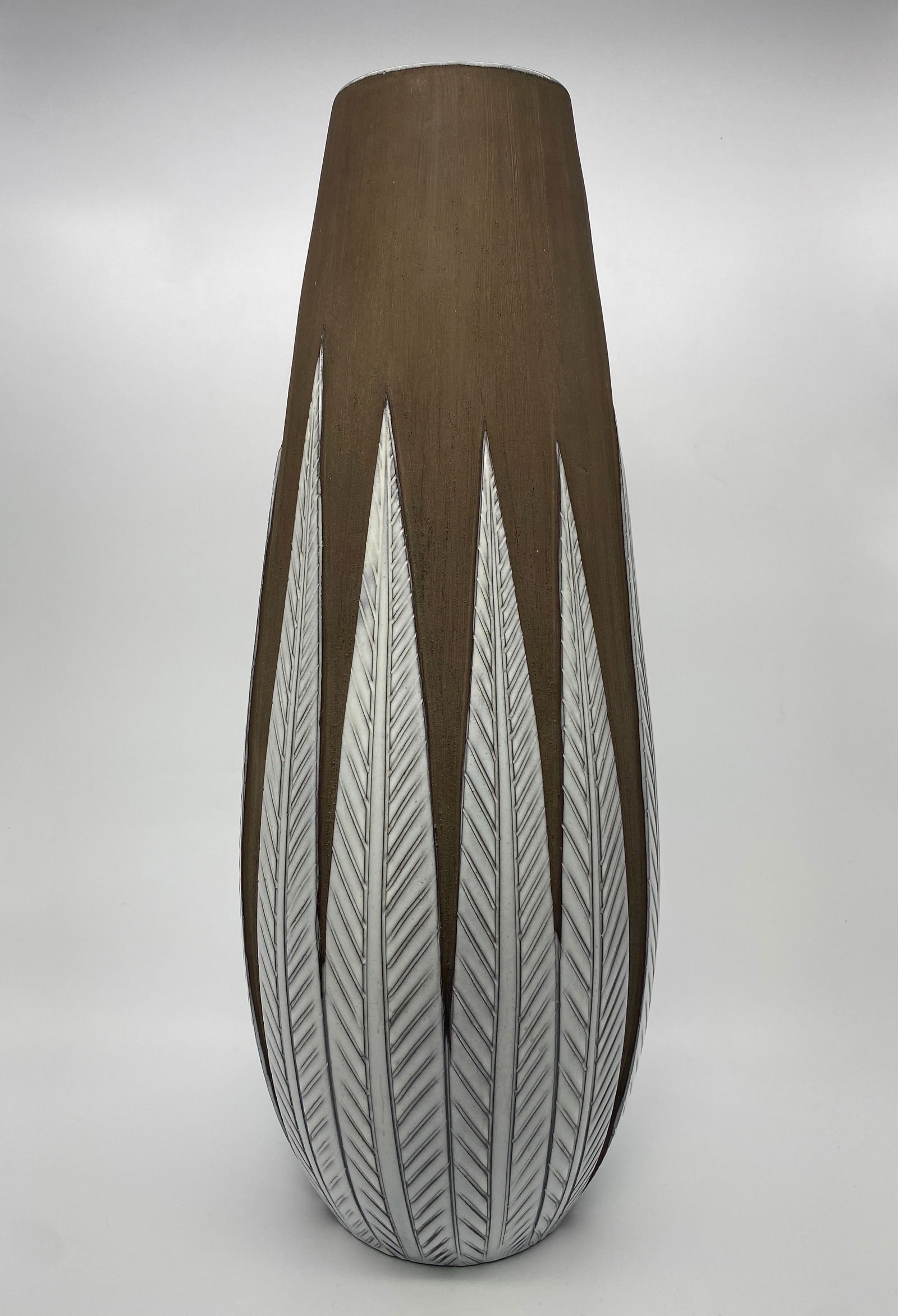 Anna-Lisa Thomson for Uppsala Ekeby, Sweden c1950s: Anna-Lisa Thomson designed the athene series in 1950 for Upsala-ekeby. It consists of earthenware objects with gently swelling forms and white surrealistic motifs on brown background. Very large stone