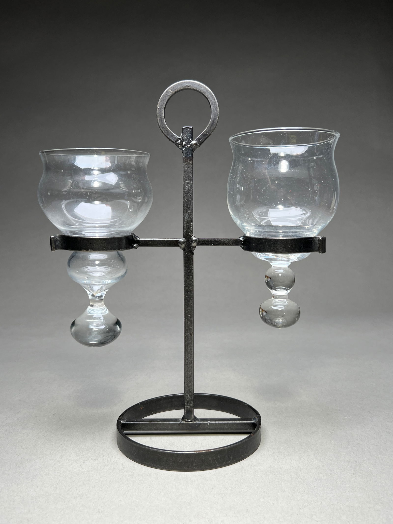 Bertil Vallien Glass & Wrought Iron Candle Holder for Boda Smide, Sweden - c.1960s: Bertil Vallien Glass & Wrought Iron Candle Holder for Boda Smide, Sweden - c.1960s Striking candle holder designed by Bertil Vallien for Boda Smide, featuring two hand-blown clear glass vessels with b