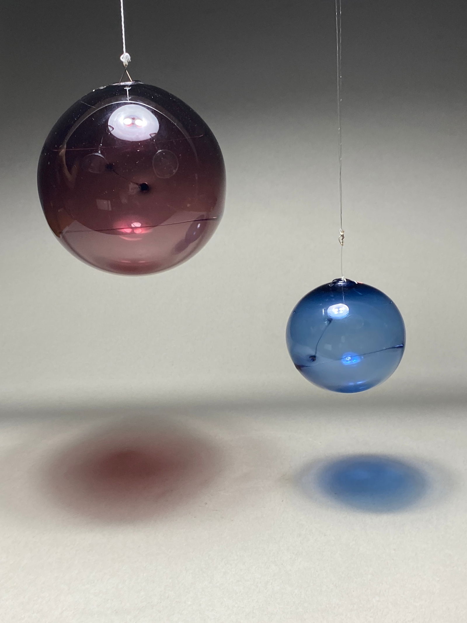 Pair of Glass hanging Sun Ball Aurinkopallo by Timo Sarpaneva for Iittala, Finland: Pair of Glass hanging Sun Ball Aurinkopallo by Timo Sarpaneva for Iittala, Finland The Solar Ball (Aurinkopallo) masterfully unites form and color in art glass. This captivating pair features a red or