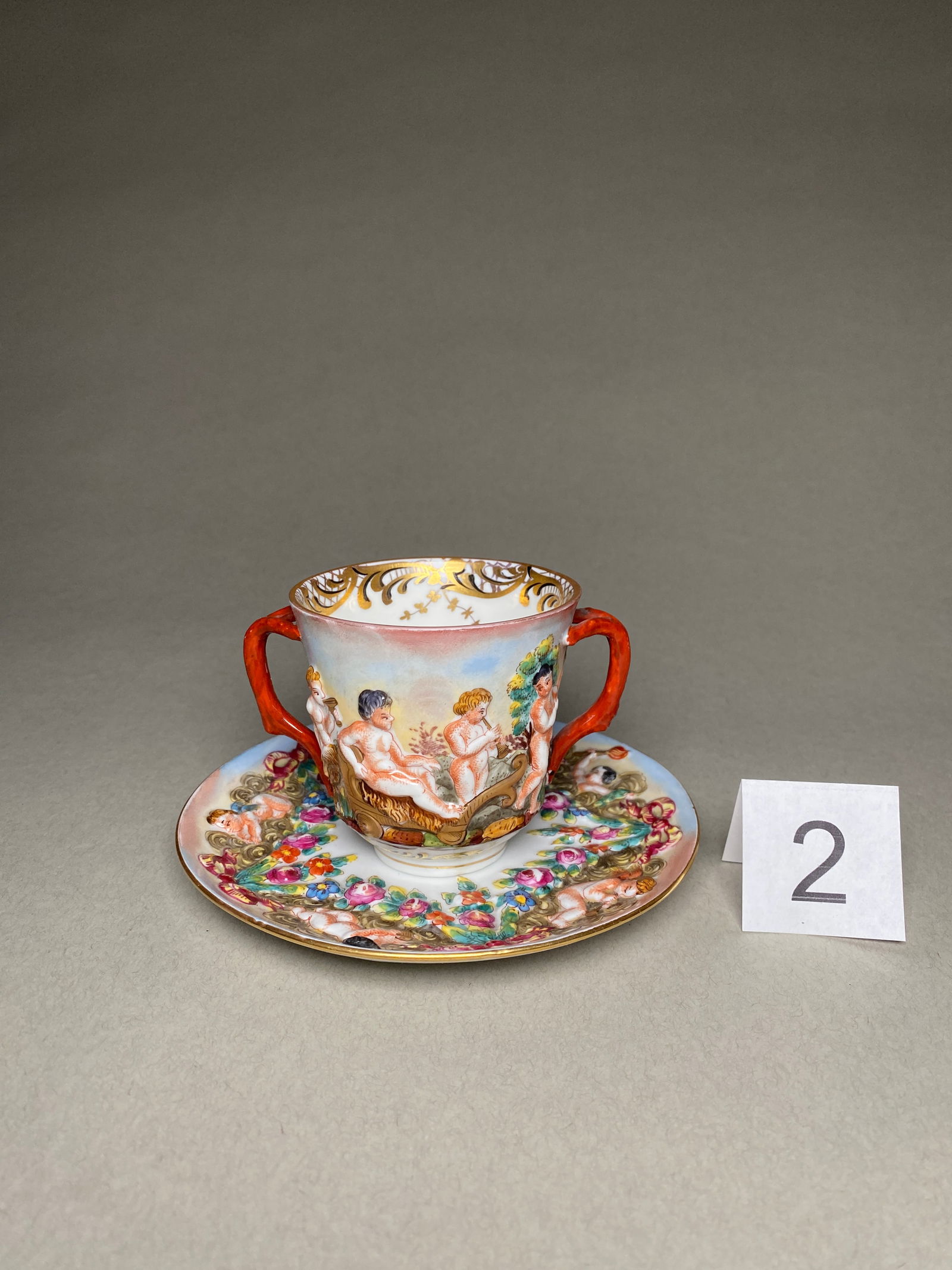 Late 19th Century Capodimonte Porcelain Chocolate Cup, Saucer: Late 19th Century Capodimonte Porcelain Chocolate Cup, Saucer This porcelain chocolate cup, saucer was produced in Italy by Capodimonte in the late 19th century. The cup and saucer are marked with the
