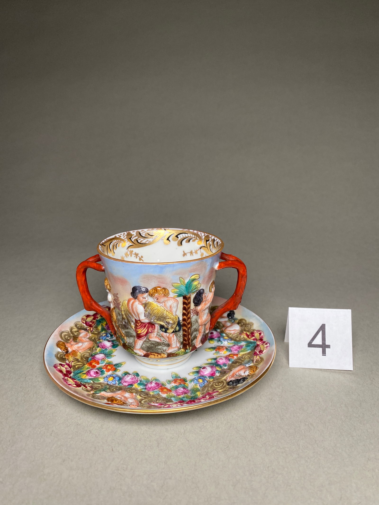 Late 19th Century Capodimonte Porcelain Chocolate Cup, Saucer: Late 19th Century Capodimonte Porcelain Chocolate Cup, Saucer This porcelain chocolate cup, saucer was produced in Italy by Capodimonte in the late 19th century. The cup and saucer are marked with the