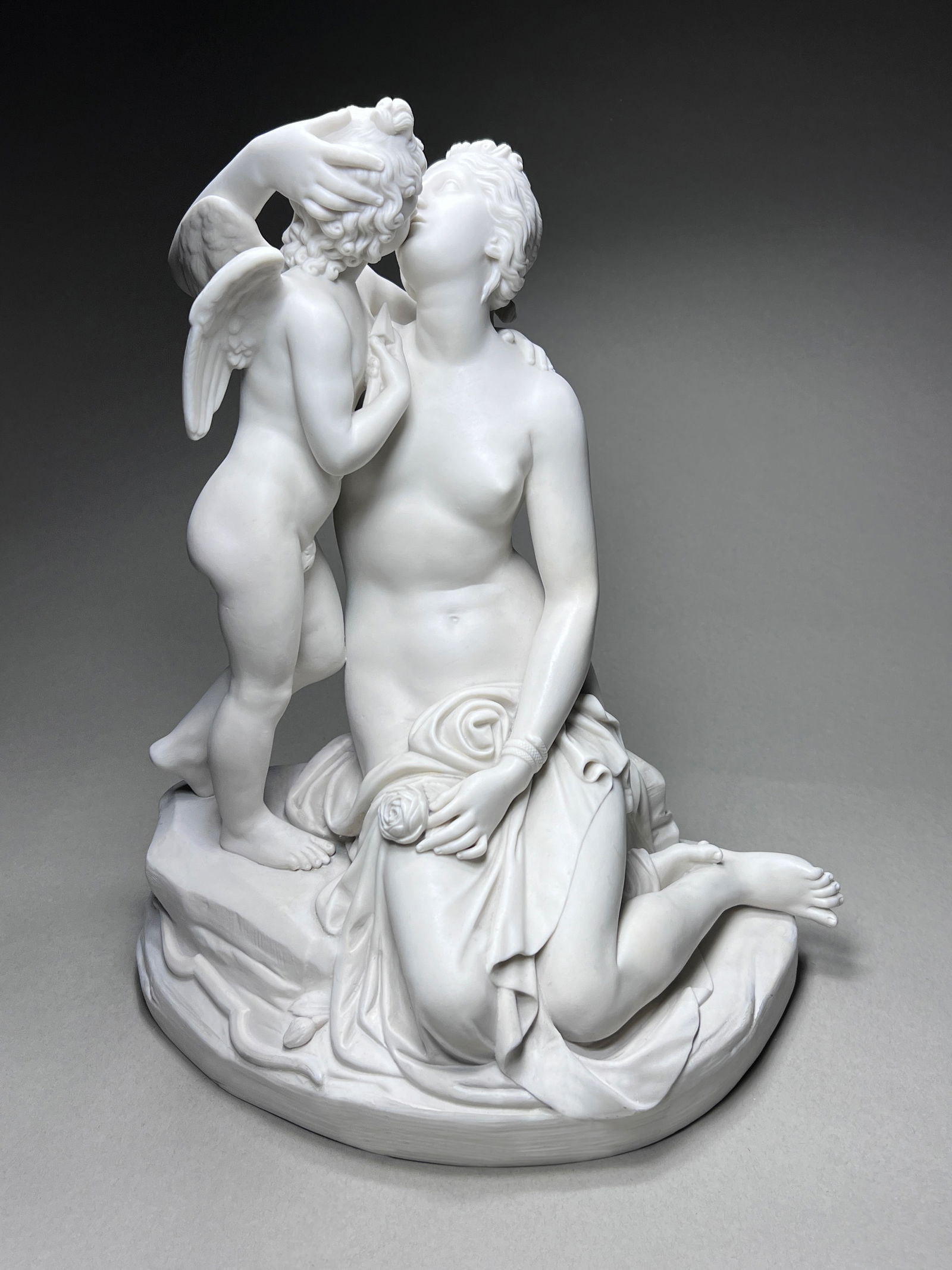 Large 19th Century English Minton Parian Venus and Cupid: Large 19th Century English Minton Parian Venus and Cupid Parian figural group, titled Venus and Cupid, is a remarkable work by the esteemed English sculptor John Gibson (1790-1866). It features the Mi