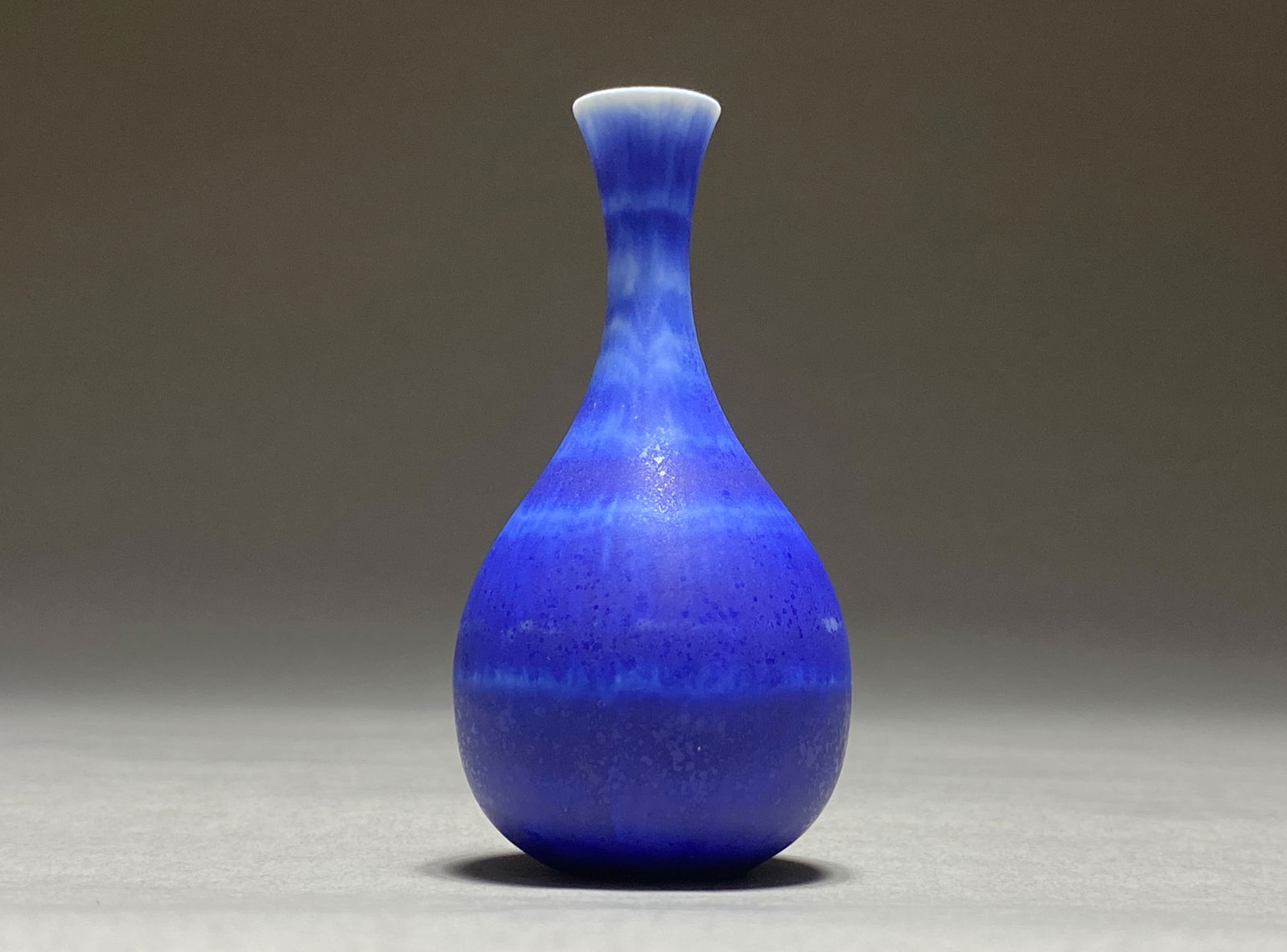 Gunnar Nylund for Rorstrand, Petite Blue Vase, Sweden, 1950s: Gunnar Nylund for Rorstrand, Petite Blue Vase, Sweden, 1950s This striking modernist vase features a perfectly proportioned silhouette - a generously rounded base ascending to an elegantly elongated n