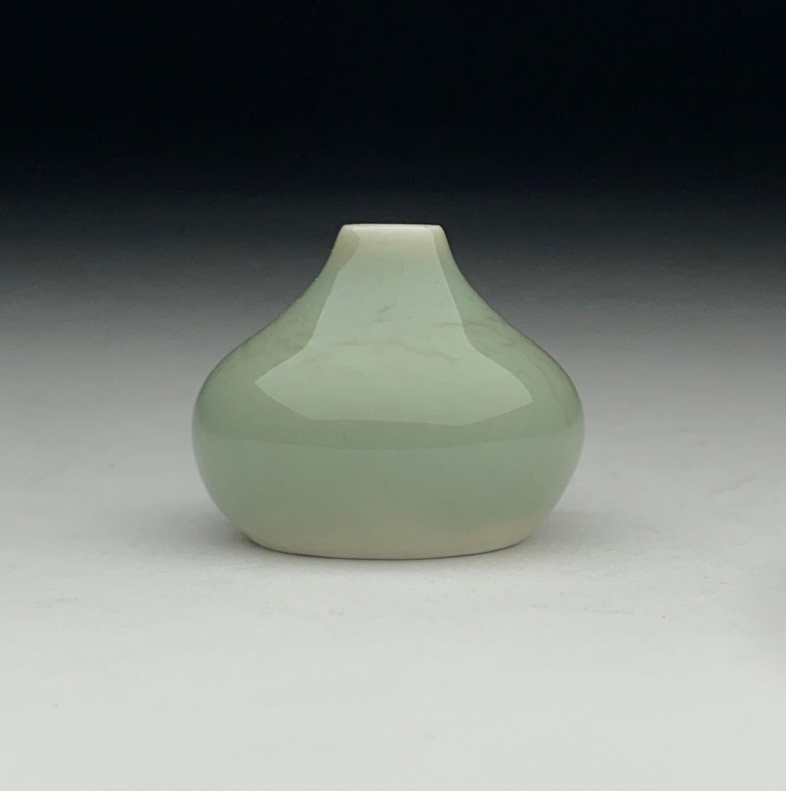 Carl-Harry Stalhane Petite Stoneware Vase - Mid 20th Century: Carl-Harry Stalhane Petite Stoneware Vase - Mid 20th Century Delicately rounded form with a narrow, tapering neck and small mouth, the surface finished in a soft celadon-green glaze with subtle tonal
