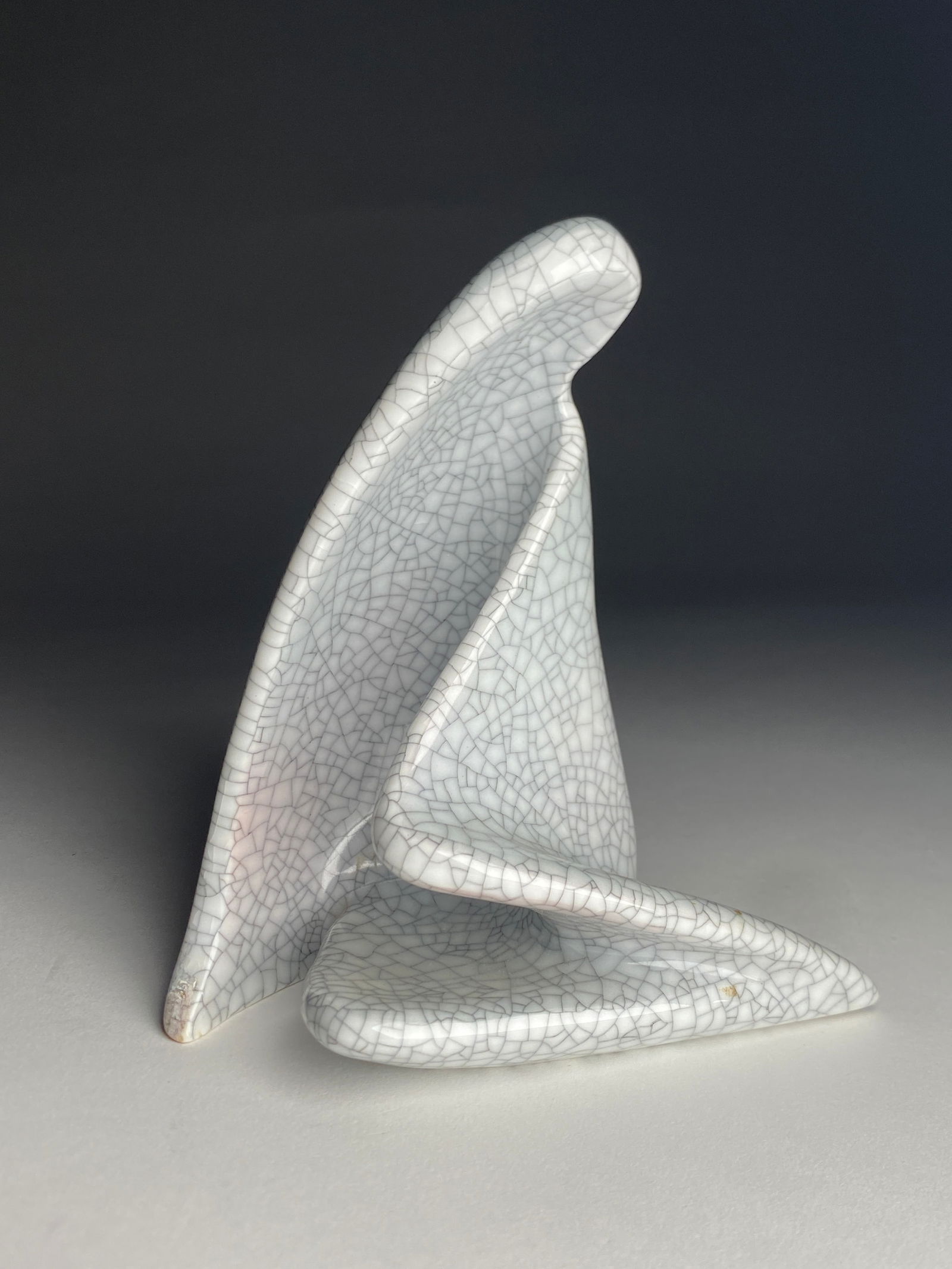 Rosenthal Hans Stangl Crackle Glaze Porcelain Sculpture, Seated Woman - 1957: Hans Stangl Crackle Glaze Porcelain Sculpture, Seated Woman - 1957 Abstractly modeled porcelain figure of a seated woman, the form reduced to flowing, draped planes that curve and fold into one anothe