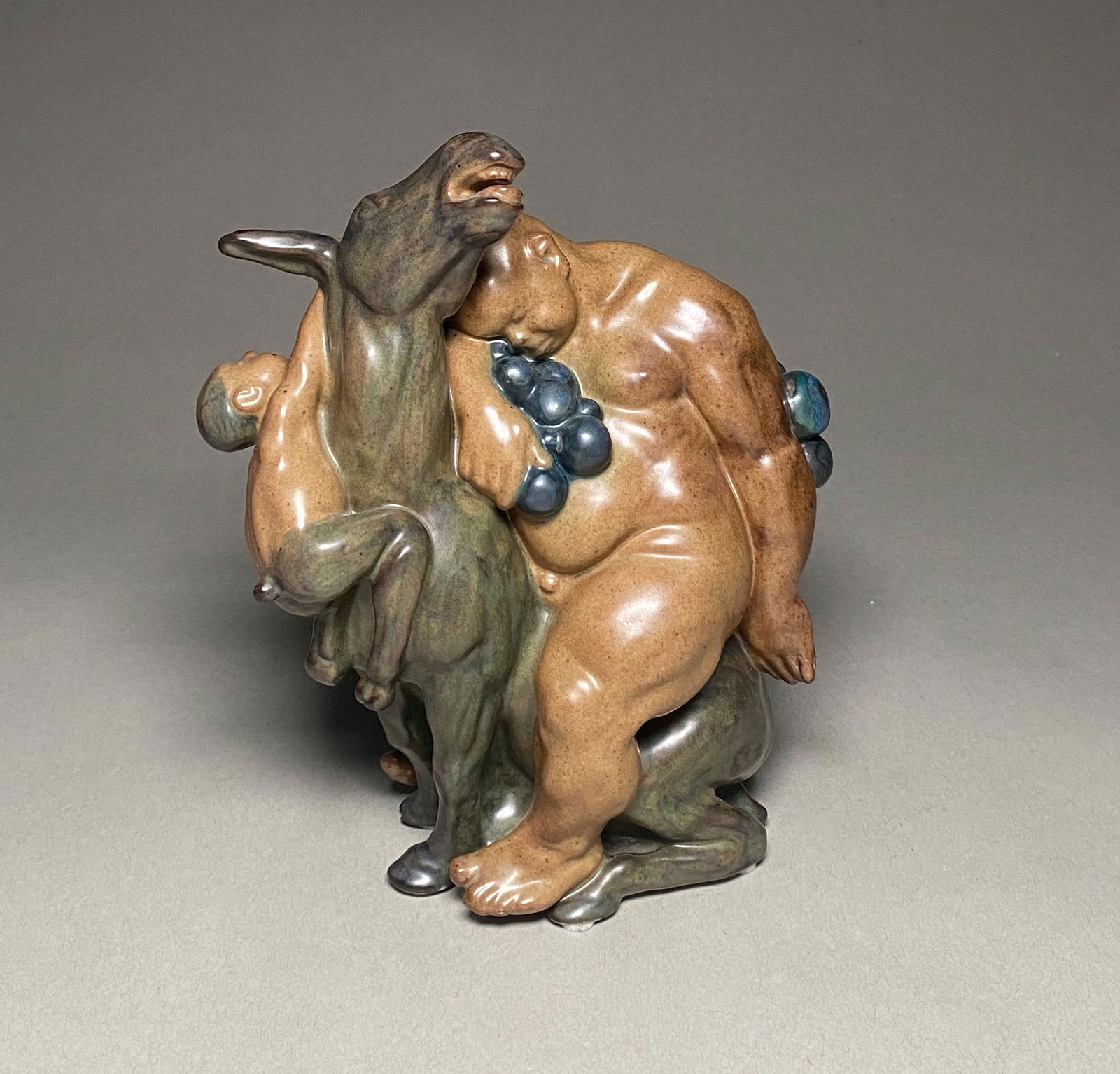 Kai Nielsen for Bing & Grondahl - "Bacchus and the Faun" Stoneware Figure, Denmark, c. 1920s: Kai Nielsen for Bing & Grondahl - "Bacchus and the Faun" Stoneware Figure, Denmark, c. 1920s An expressive and sculpturally rich stoneware group by Danish artist Kai Nielsen (1882-1924) for Bing & Gro