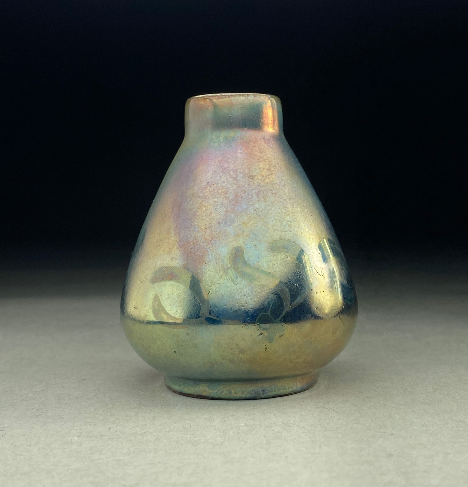 Art Nouveau Iridescent Vase by Jean Barol for Montieres, early 20th century: Art Nouveau Iridescent Vase by Jean Barol for Montieres, early 20th century This breathtaking ceramic cabinet vase showcases exceptional craftsmanship and ethereal coloration. The vase features a grac