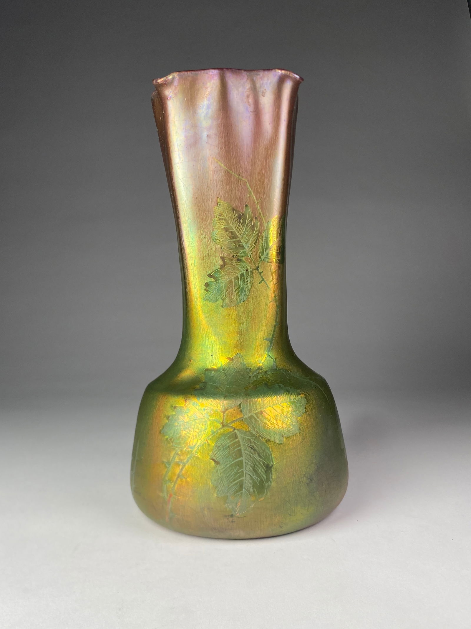 Jerome Massier Fils Ceramic and Iridescent Vase with Luscious Leaf Motifs - Late 19th/Early 20th: Jerome Massier Fils Ceramic and Iridescent Vase with Luscious Leaf Motifs - Late 19th/Early 20th Century This striking vase rises from a broad base into a tall quadrangular neck that flares with a sca