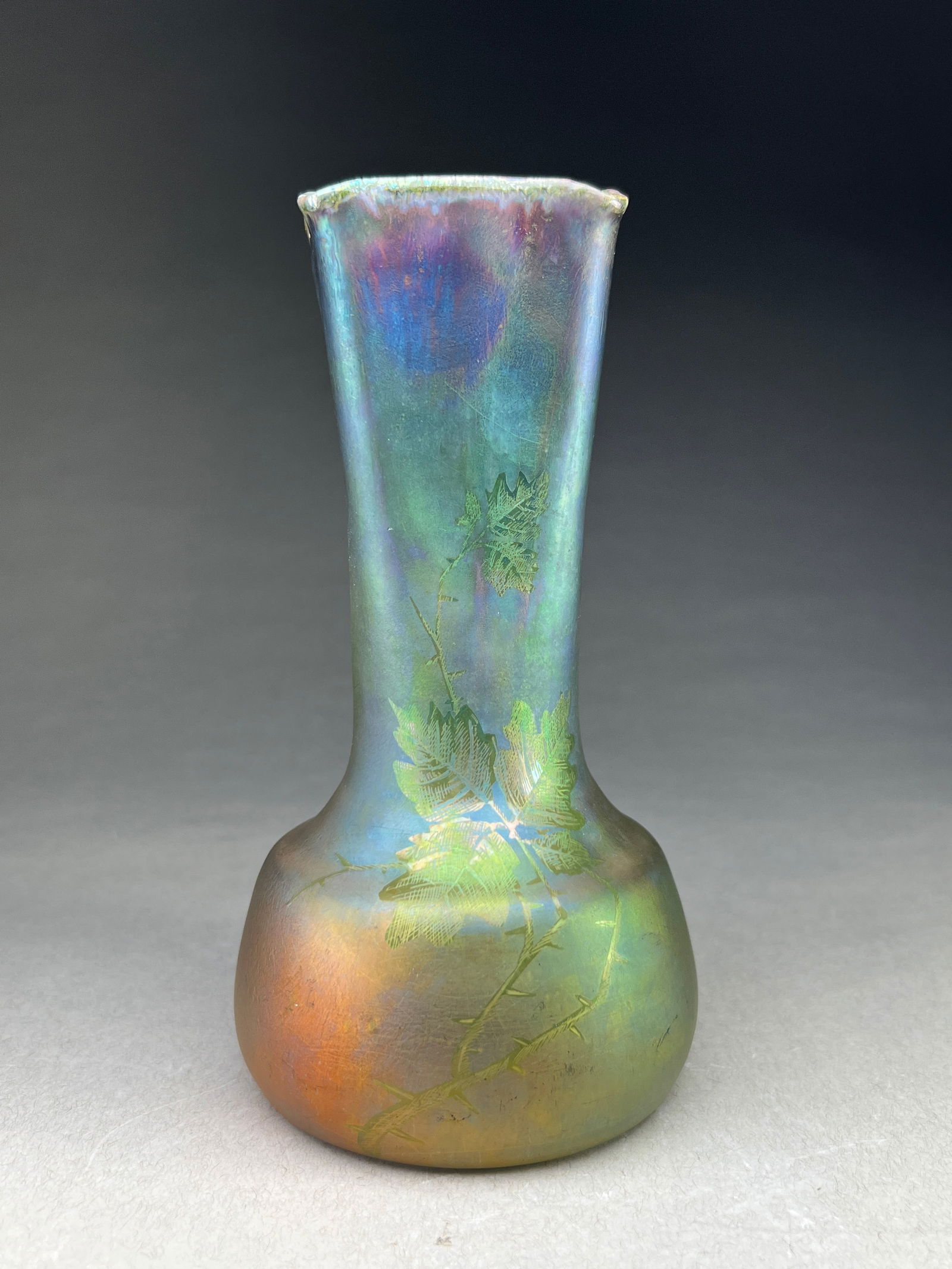 Iridescent Art Nouveau vase by Jerome Massier Vase with Luscious Leaf Motifs: Iridescent Art Nouveau vase by Jerome Massier Vase with luscious Leaf Motifs Art Nouveau iridescent vase, by Jerome Massier, showcases an elegant silhouette; the vase features a distinctive bulbous ba