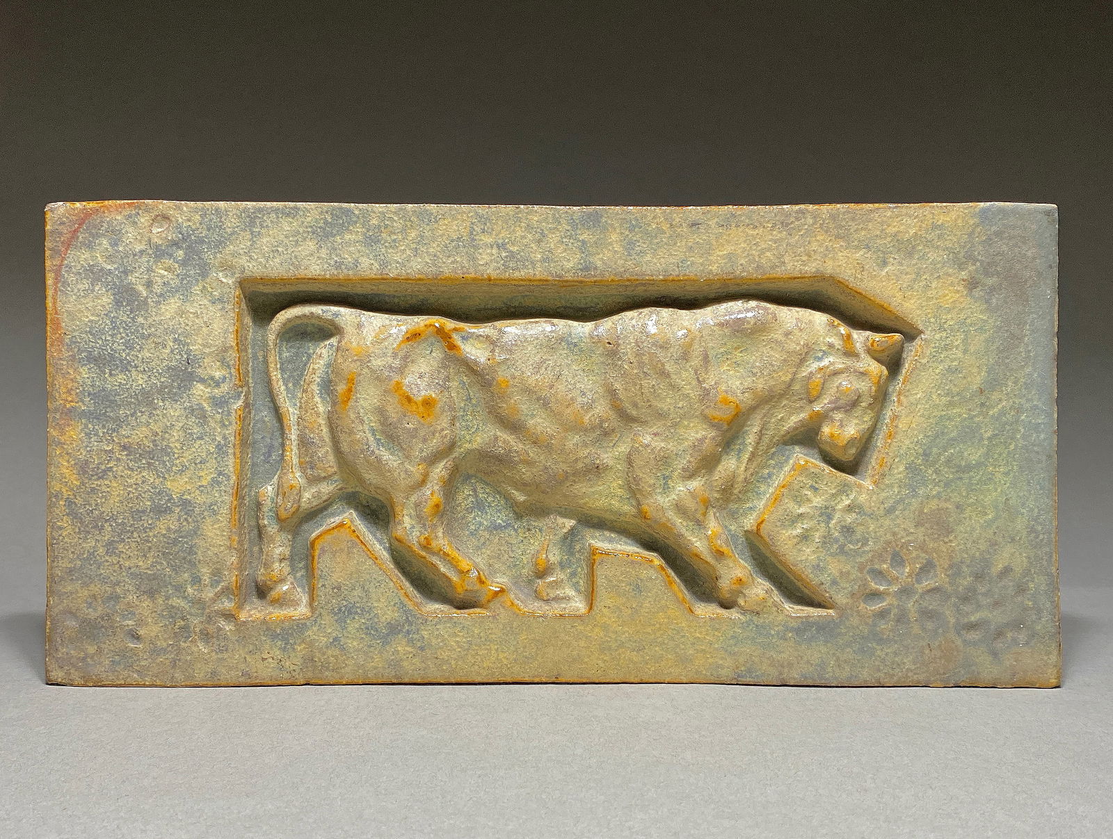 Rare Alexandre Bigot and Paul Jouve, Art nouveau tile depicting a bull, 19-20th century: Rare Alexandre Bigot and Paul Jouve, Art nouveau tile depicting a bull, 19-20th century This glazed stoneware panel showcases a harmonious blend of artistry and craftsmanship, illustrating a bull in a