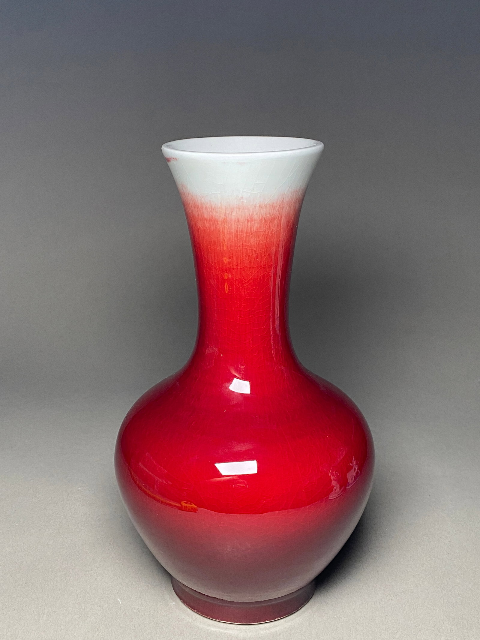 19th Century Qing Dynasty Sang de Boeuf Vase with Oxblood Glaze: 19th Century Qing Dynasty Sang de Boeuf Vase with Oxblood Glaze Sang de Boeuf vase, dating from the 19th century during the Qing Dynasty (1644-1912), exemplifies the artistry and sophistication of Chi