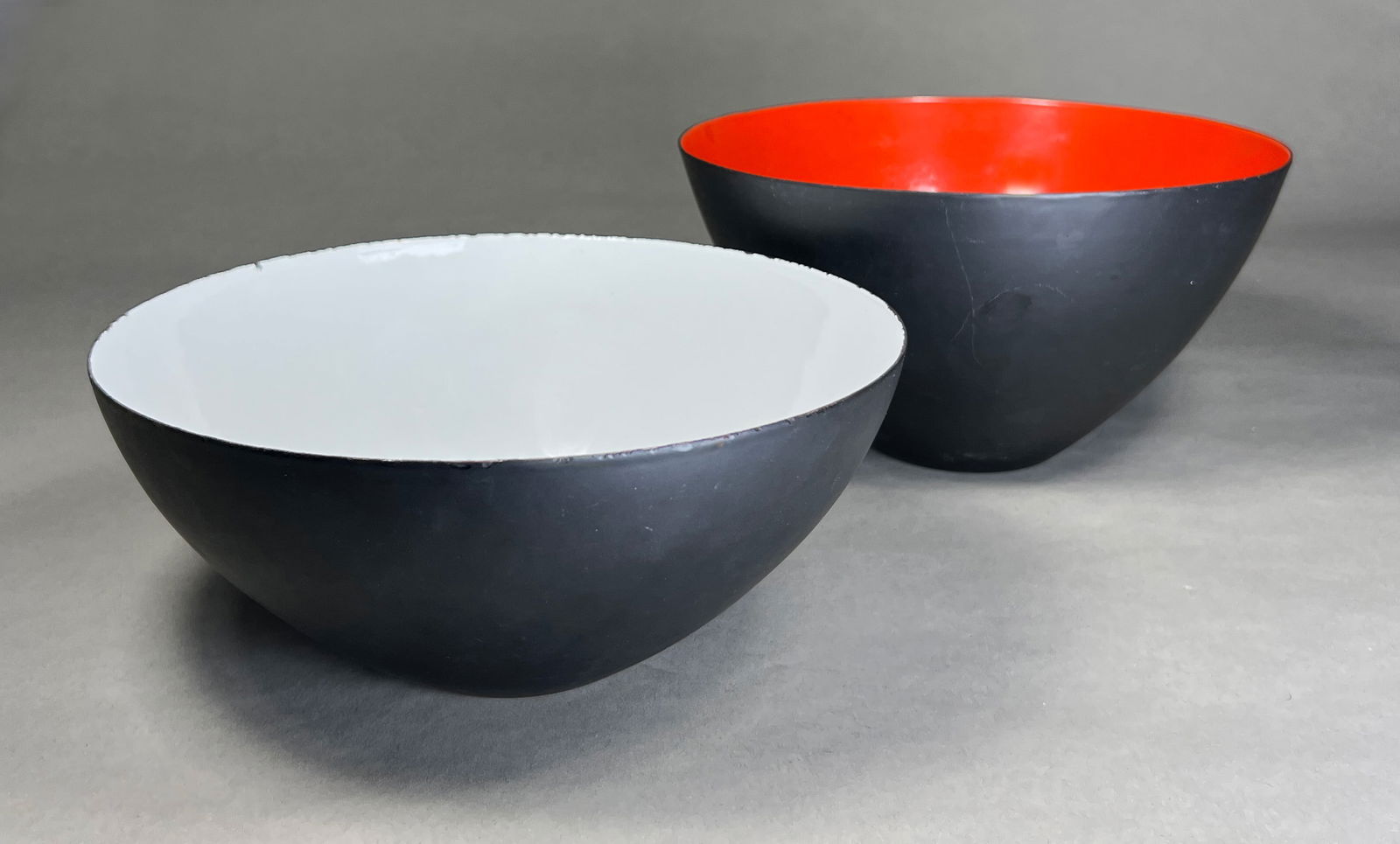 Herbert Krenchel Krenit Enamel Bowls for Torben Orskov - c.1950s: Herbert Krenchel Krenit Enamel Bowls for Torben Orskov - c.1950s Pair of Krenit bowls featuring distinctive hemispheric forms with contrasting color schemes. The pair includes a white interior/black e