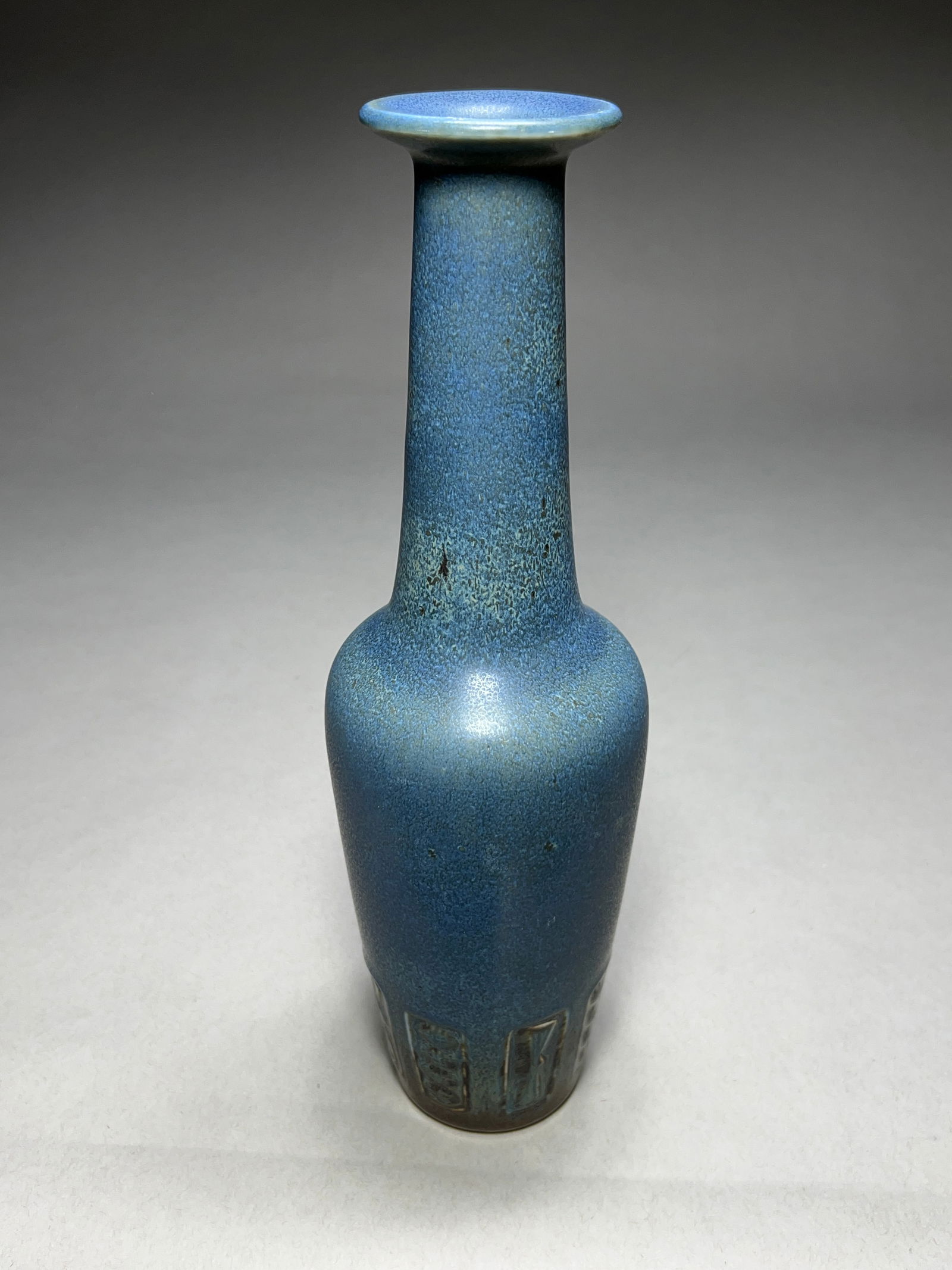 Gunnar Nylund Blue Stoneware Vase for Rorstrand - c.1960s: Gunnar Nylund Blue Stoneware Vase for Rorstrand - c.1960s Stoneware vase featuring a slender bottle form with distinctive carved geometric relief pattern around the base. The piece showcases Nylund's