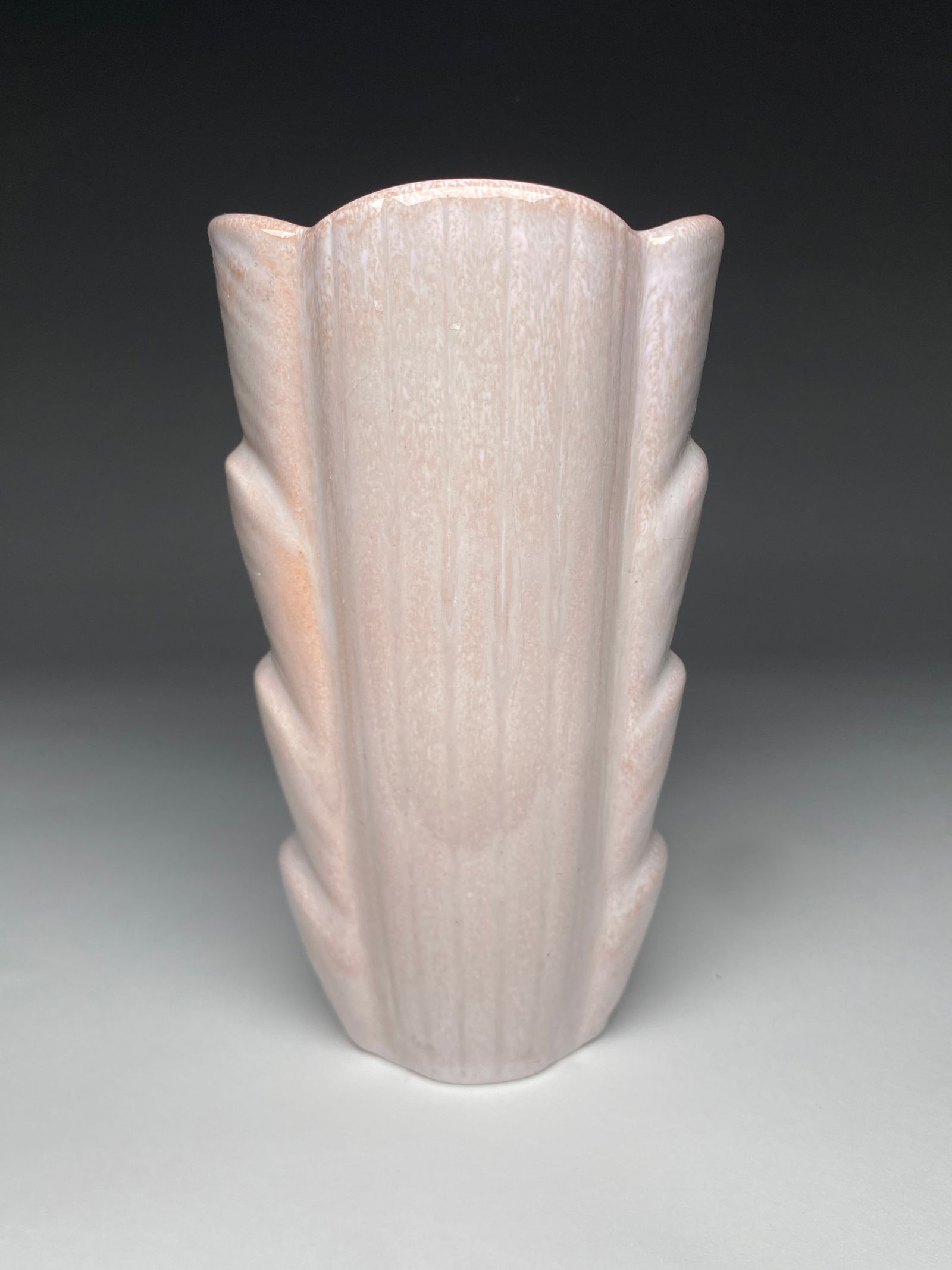 Gunnar Nylund Fluted Pink Ceramic Vase for Rorstrand - c.1940s: Gunnar Nylund Fluted Pink Ceramic Vase for Rorstrand - c.1940s Striking architectural vase featuring a dramatic fluted form with stylized projections along the sides. The piece is finished in a delica