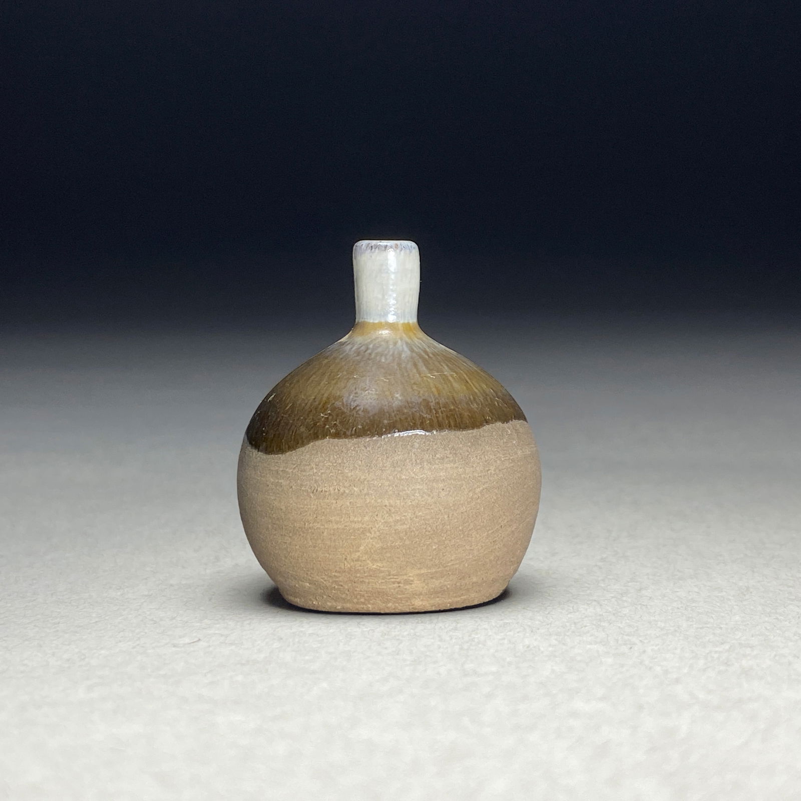 Scandinavian Modernist, Light Brown Haresfur Glazed Petite Vase, 1960s: Scandinavian Modernist, Light Brown Haresfur Glazed Petite Vase, 1960s This remarkable minimalist vase with a generously rounded body, crowned by a distinctive cylindrical neck. With a sophisticated t