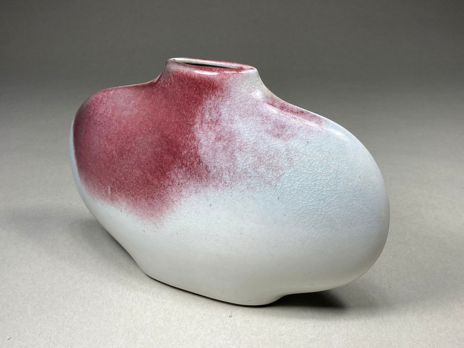 Lentille Vase by Yves Mohy for Virebent,1970s: Lentille Vase by Yves Mohy for Virebent, 1970s This porcelain vase exemplifies the minimalism characteristic of 1970s French modernist ceramics. Designed by Yves Mohy for Virebent Manufacture, the 'Le