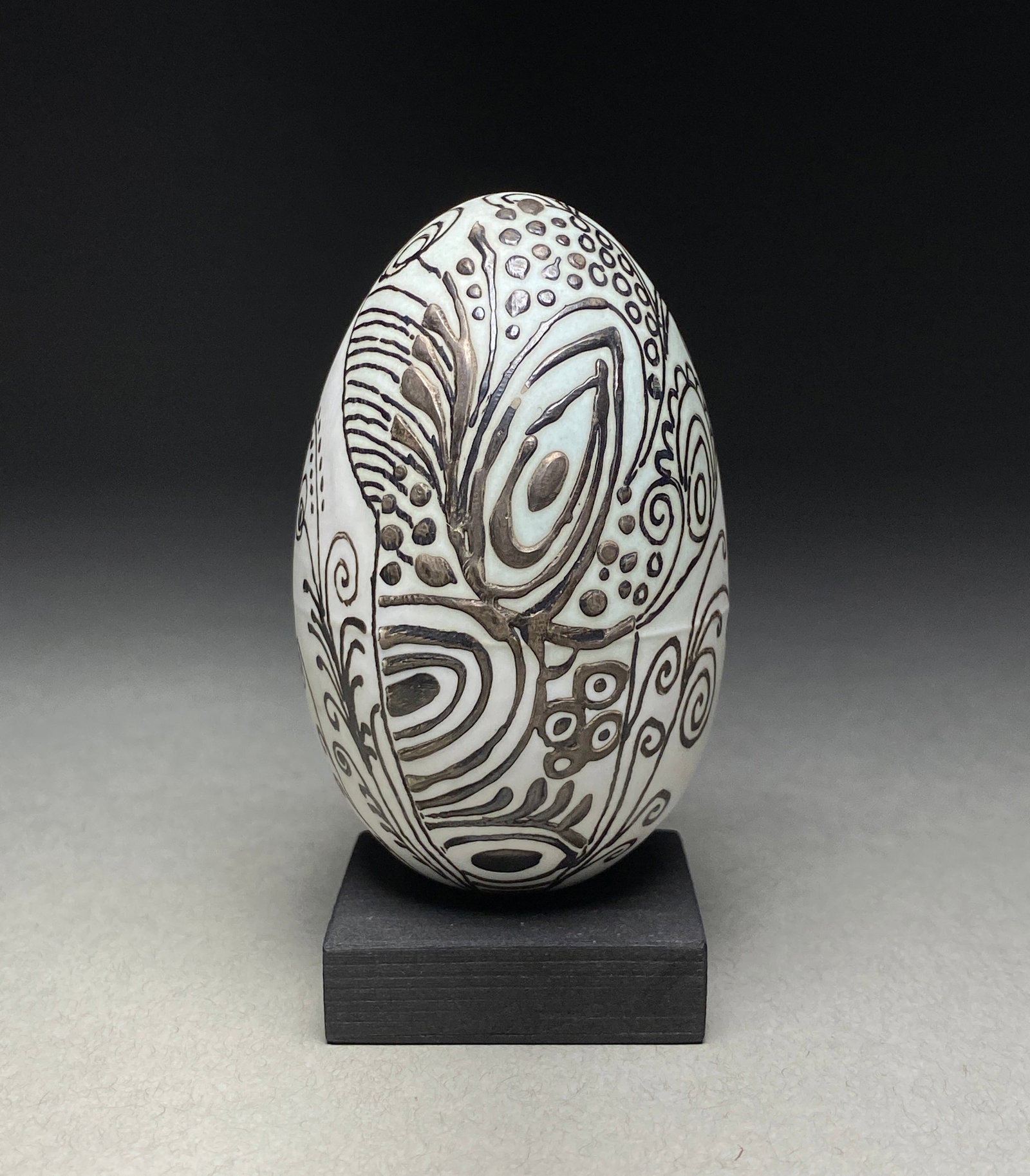 Stig Lindberg Ceramic Egg, Sgraffito Technique, Sweden, Circa 1960: Stig Lindberg Ceramic Egg, Sgraffito Technique, Sweden, Circa 1960 A decorative ceramic egg by Stig Lindberg, showcasing his distinctive sgraffito technique on a white ground. The piece demonstrates t