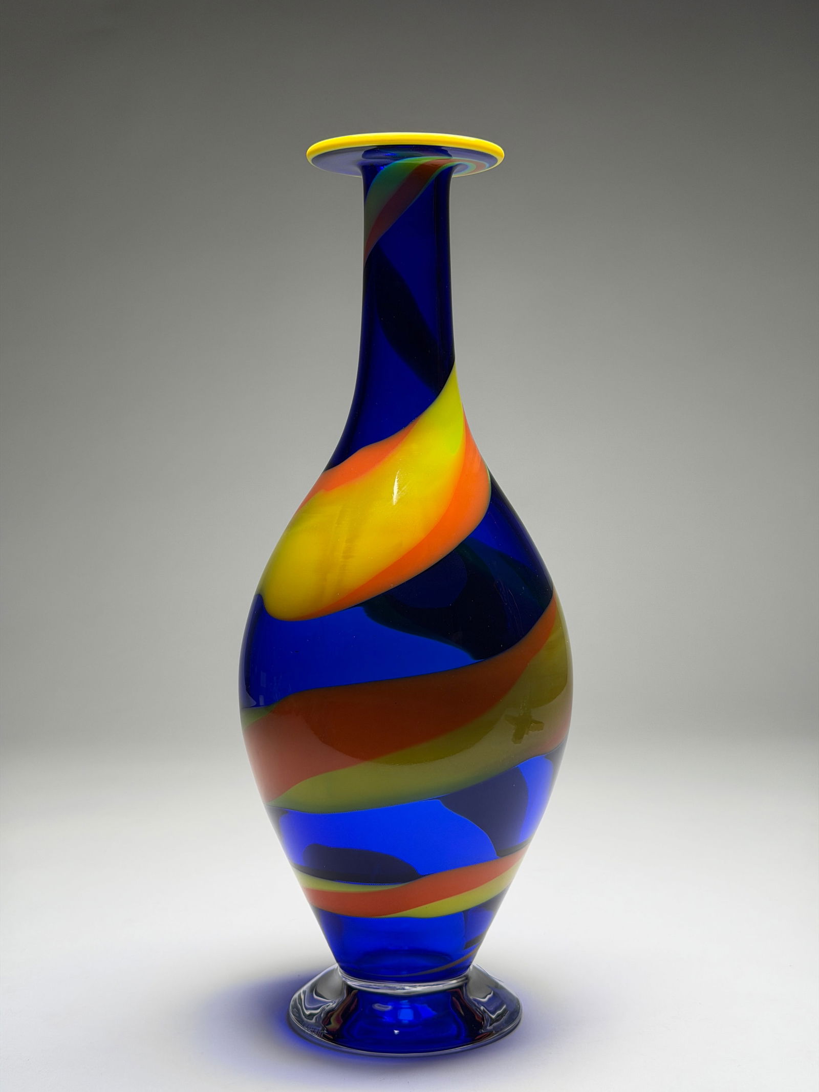 Erika Lagerbielke Mid Century Modern Glass Vase "Solo" for Orrefors - Late 20th Century: Erika Lagerbielke Glass Vase "Solo" for Orrefors - Late 20th Century This striking vase features an elegant, elongated form with a slender neck rising from a rounded body and a gently flared lip. The