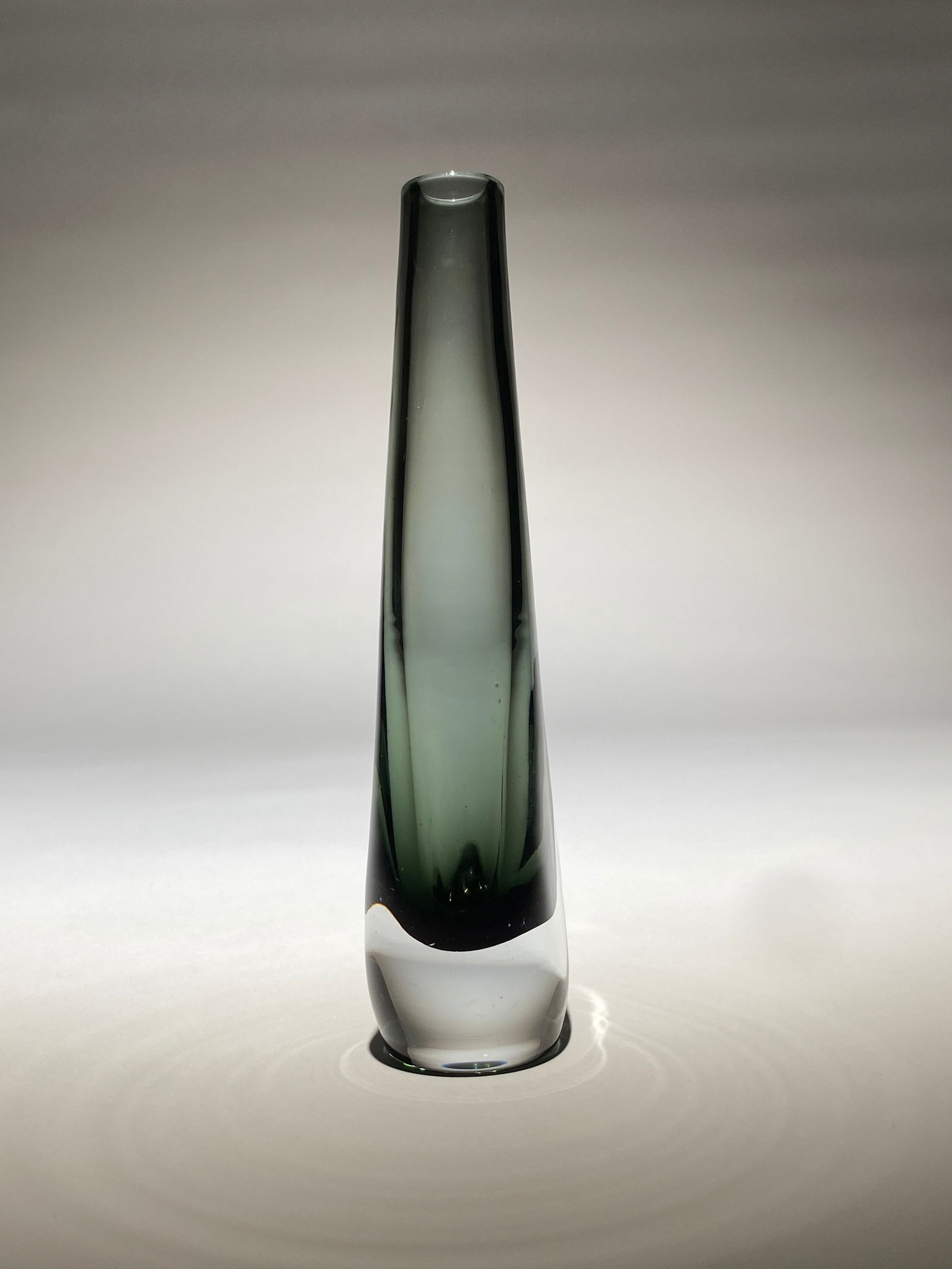 Nils Landberg for Orrefors Art Glass Vase "Dusk" - Mid Century Modern: Nils Landberg for Orrefors Art Glass Vase "Dusk" - 1960s The vase features a slender, tapering form in smoky gray-green glass. Made using the somerso technique, the vase has a translucent quality with